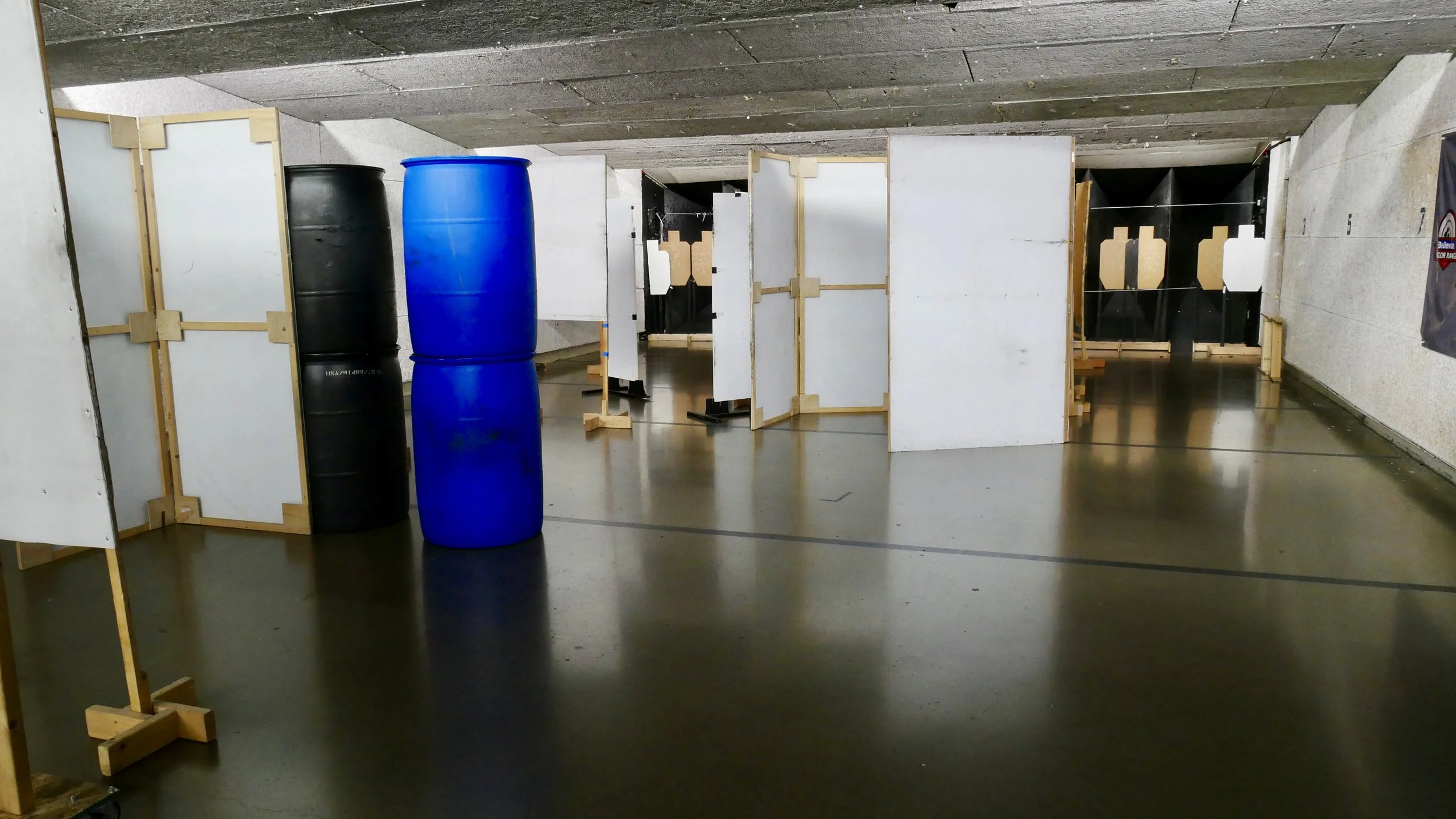 A shooting course set up with barricades and obstacles at an indoor shooting range in washington.