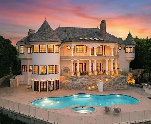 Resort-style pool and rock grotto — Beverly Hills exterior construction