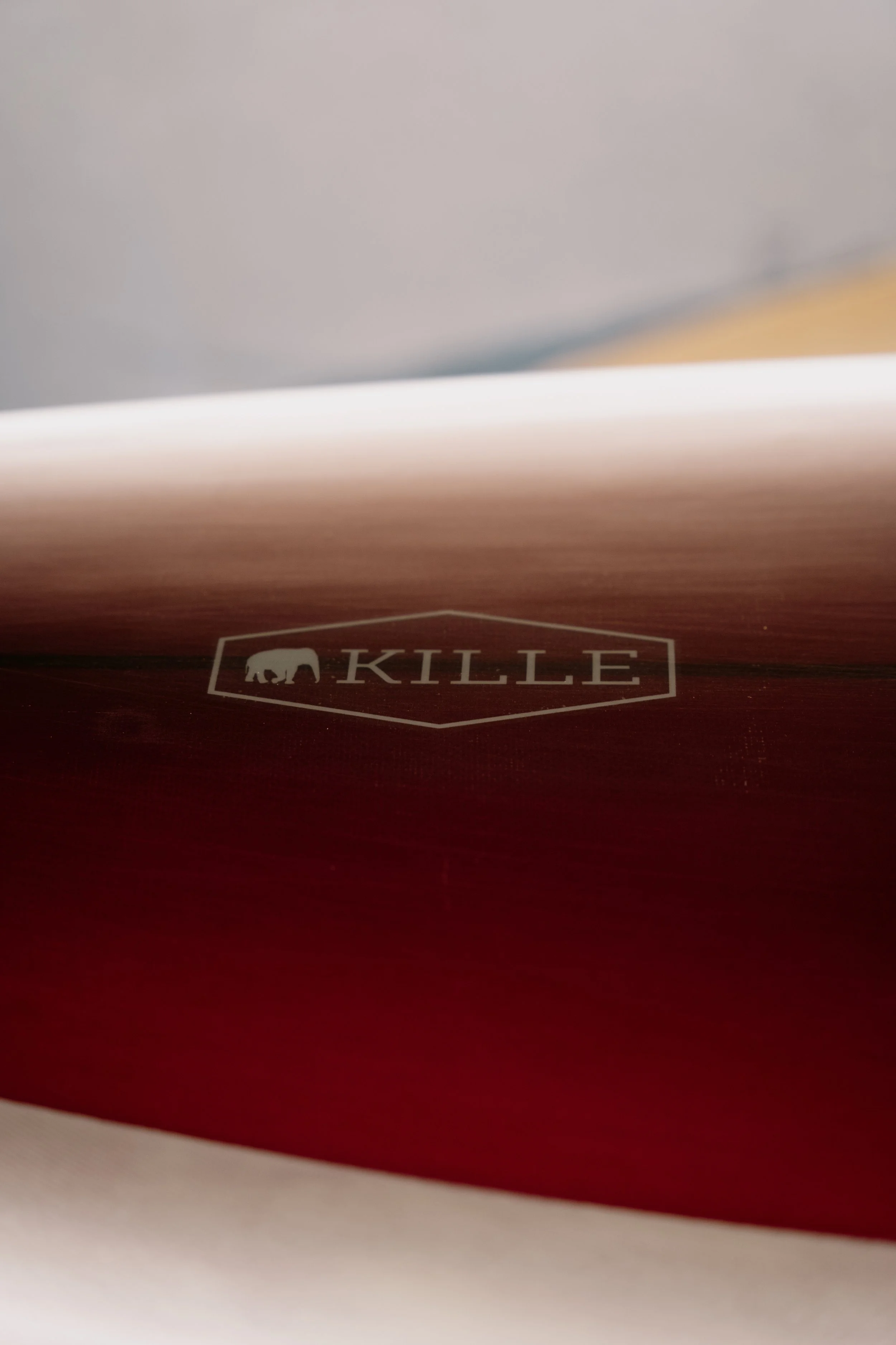 Close-up of a Jeremiah Kille surfboard with the brand name 'KILLE' and an elephant logo printed on it. Photo by Vincent Prograce