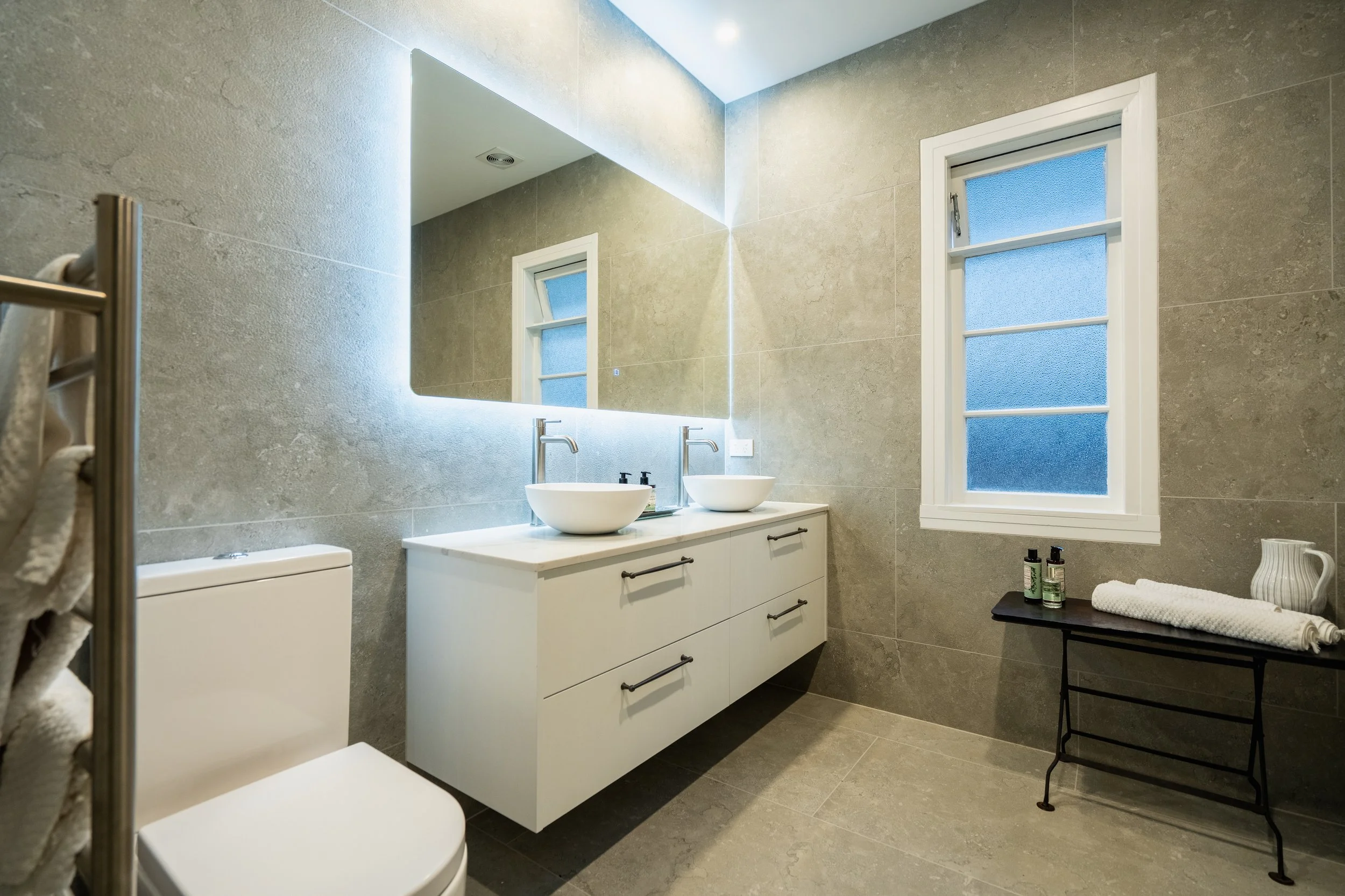 Riverhead home transformed with modern kitchen, updated bathroom & refreshed lounge.