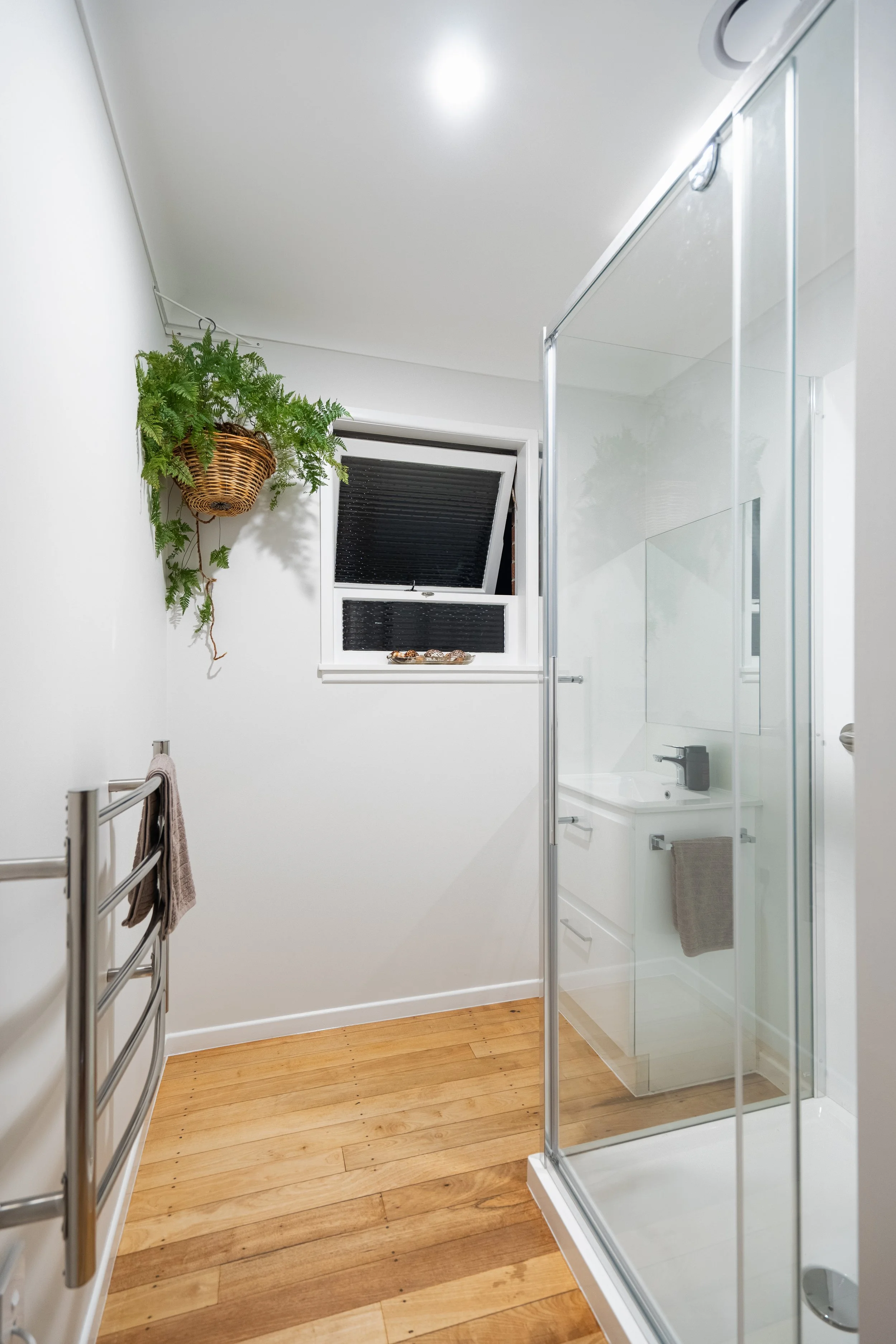 Orewa bathroom upgrade: modern toilet, shower, and vanity installation for a fresh, functional space.
