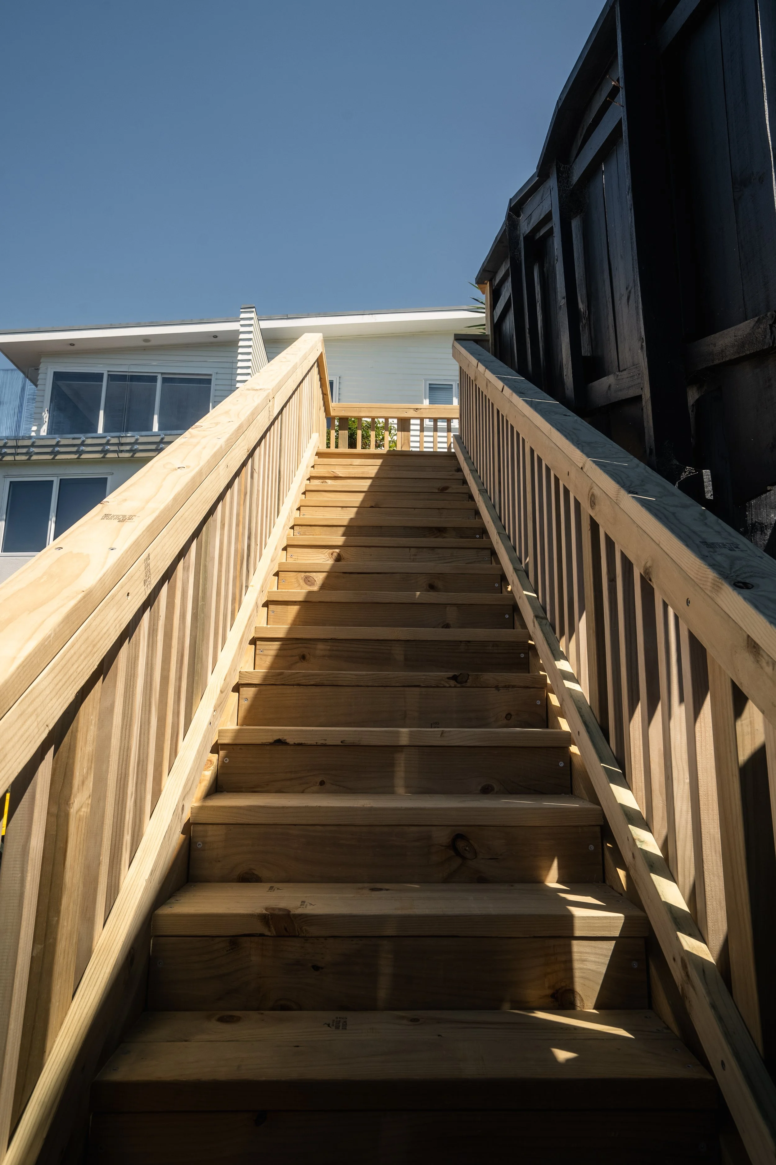 Custom wooden staircase installation in Stanmore Bay, crafted for durability and elegance.