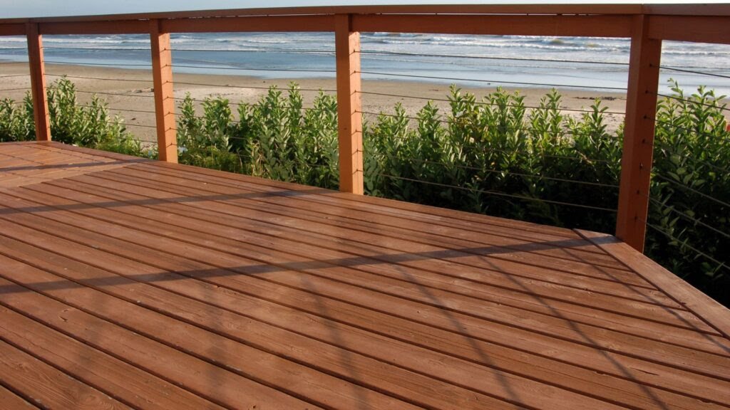 Outdoor timber deck featuring pine and hardwood boards side by side, showing colour and texture differences for homeowners choosing decking materials in New Zealand.