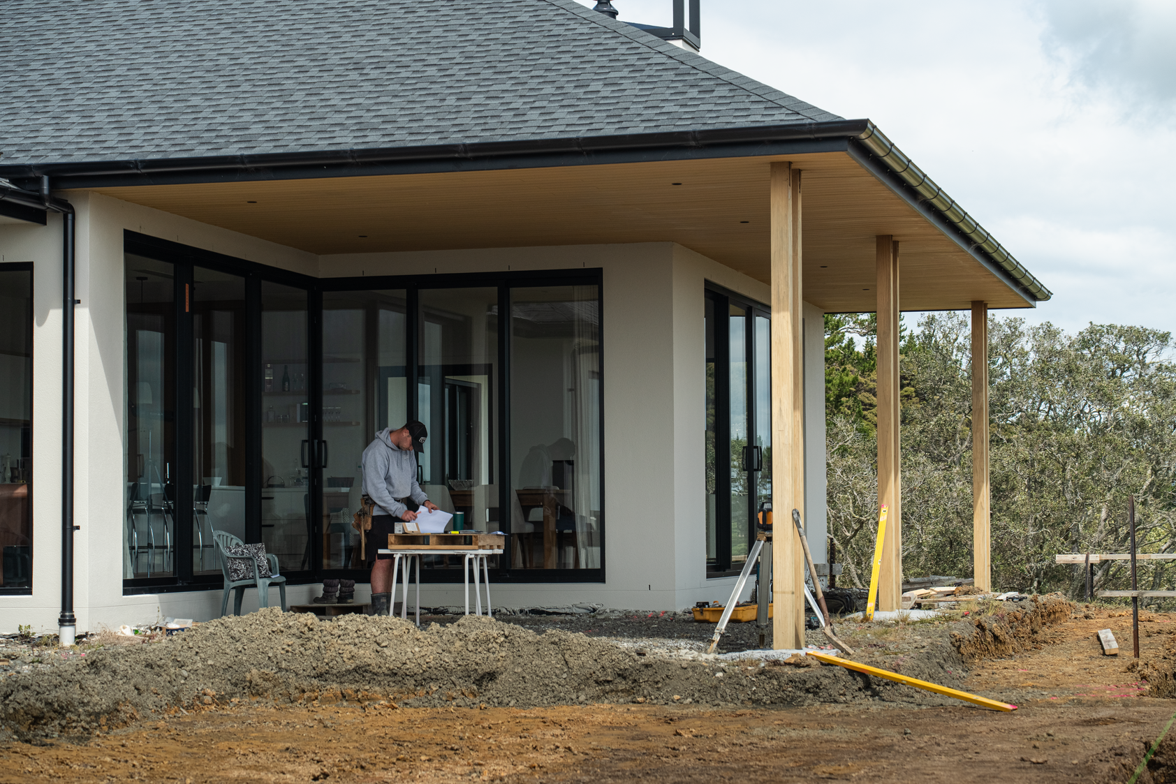 Ongoing project in Stanmore Bay: creating a new outdoor pool area with a large wrap-around deck and a hot tub, offering stunning ocean views