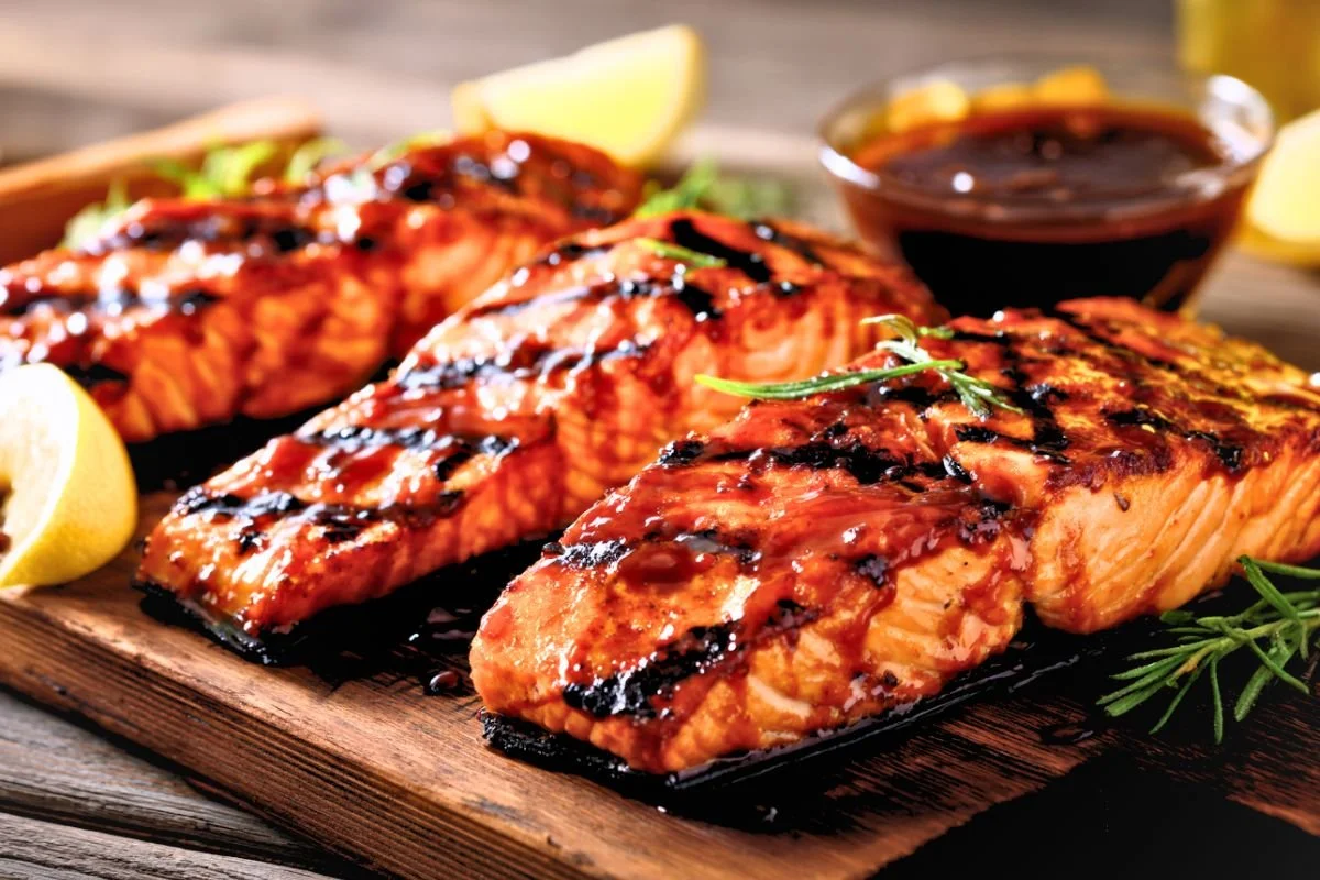 Close-up of flaky brown sugar bourbon grilled salmon with a glossy caramelized glaze