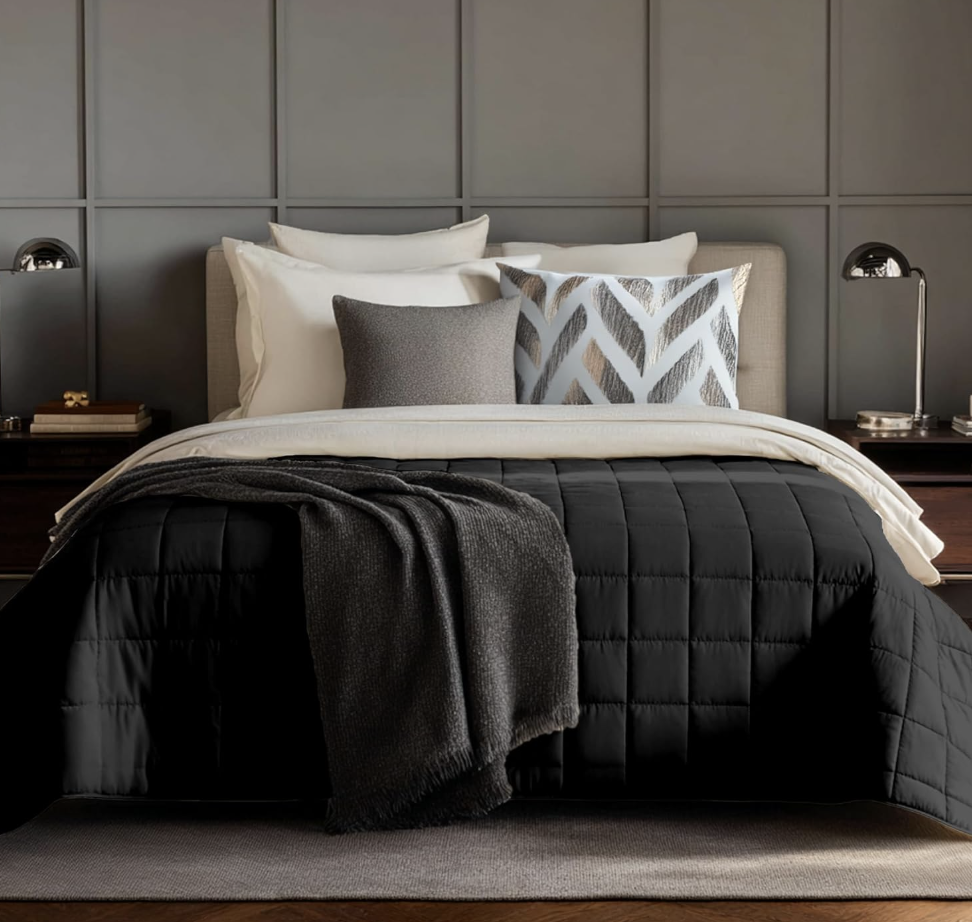 weighted blanket in a cozy grey black and white bedroom