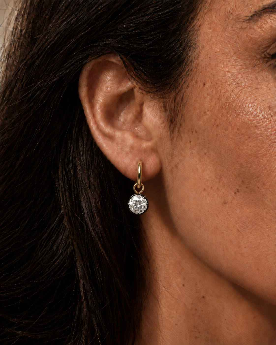 Golden Hoop Earring Close-Up.png