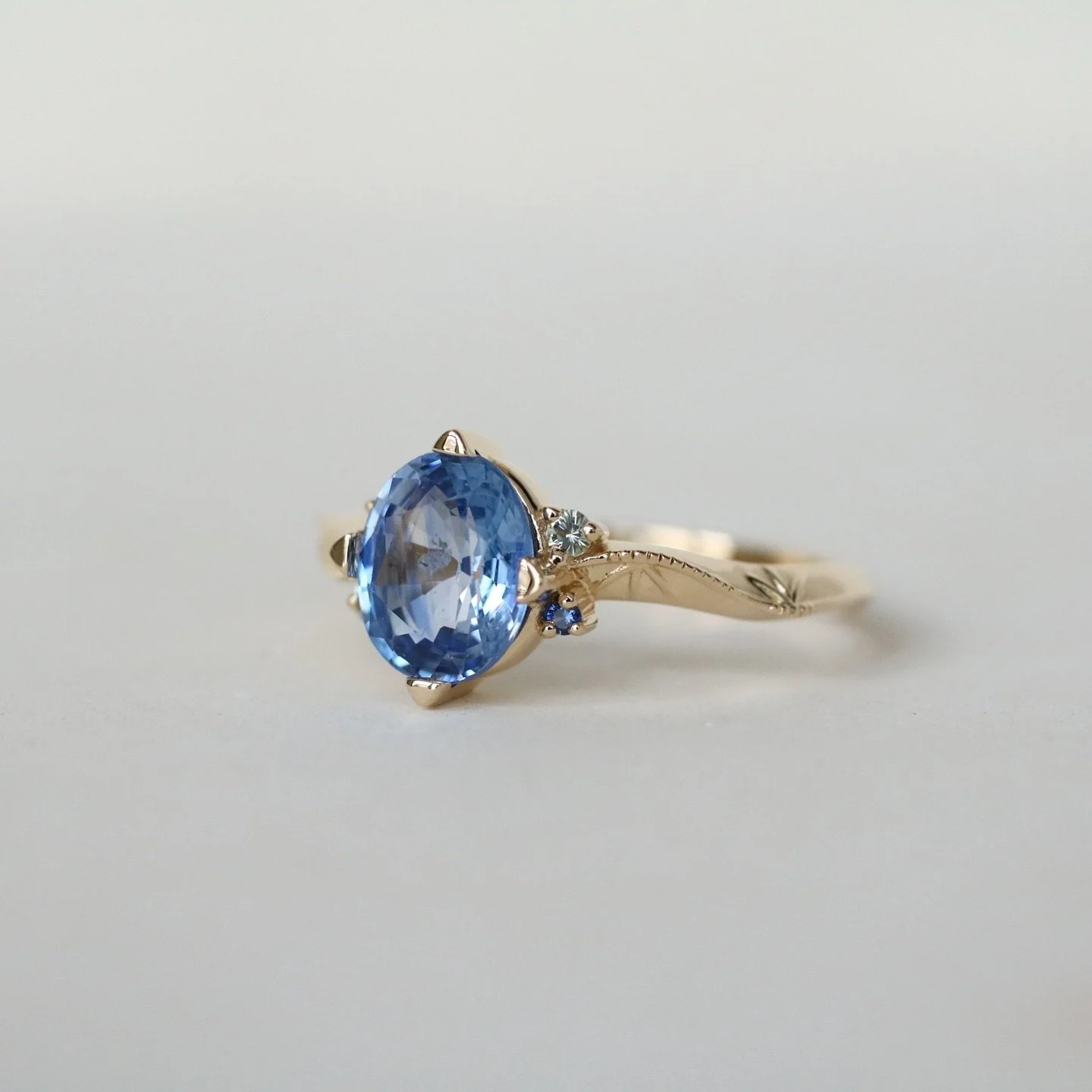 A sea of blues and greens, clean lines, balanced, and a harmonious play of natural and functional elements ~ just a few of the concepts I played with to create Jessica&rsquo;s engagement ring. Swipe through to see it from all angles and her moodboard
