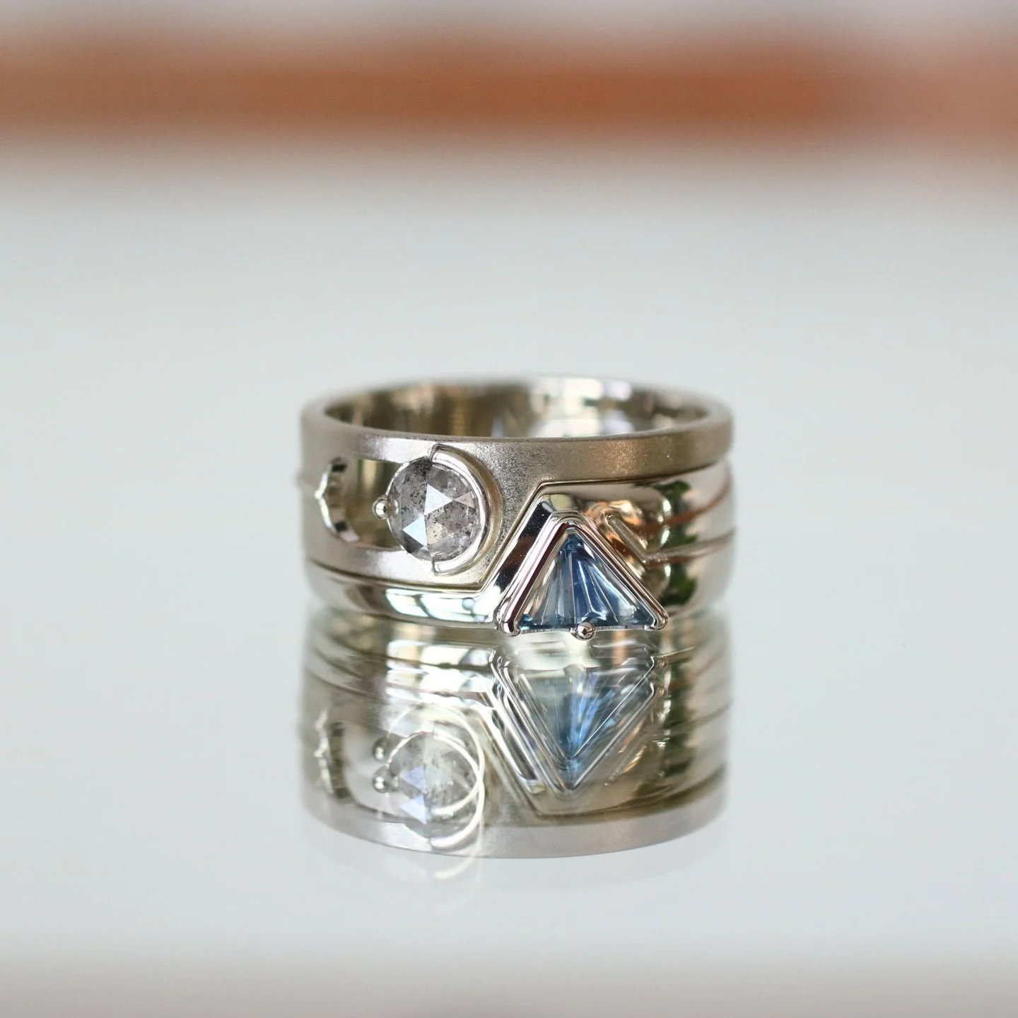 This is geometric goodness at its finest! I had such a fun time designing this wedding set for Sam. He flew all the way from Boston with a vision and to hand select this duo of gems. It was all about geometry, balance, contrast, and funky shapes. Swi