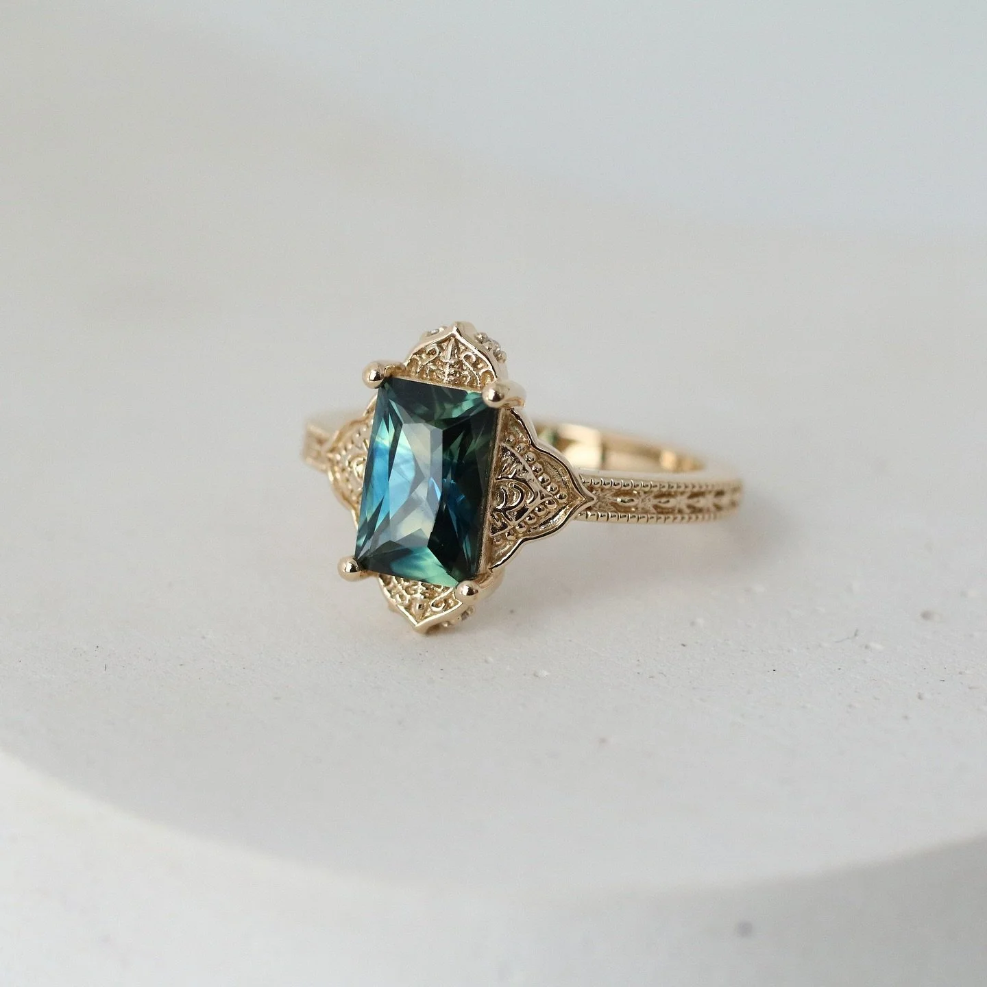 That sapphire tho 😱 This was a fun design challenge of blending a bold, modern shape with ancient motifs inspired by Aastha&rsquo;s cultural heritage. 

Congratulations to Aastha &amp; Vamsi on their official engagement! 

Swipe through to see that 