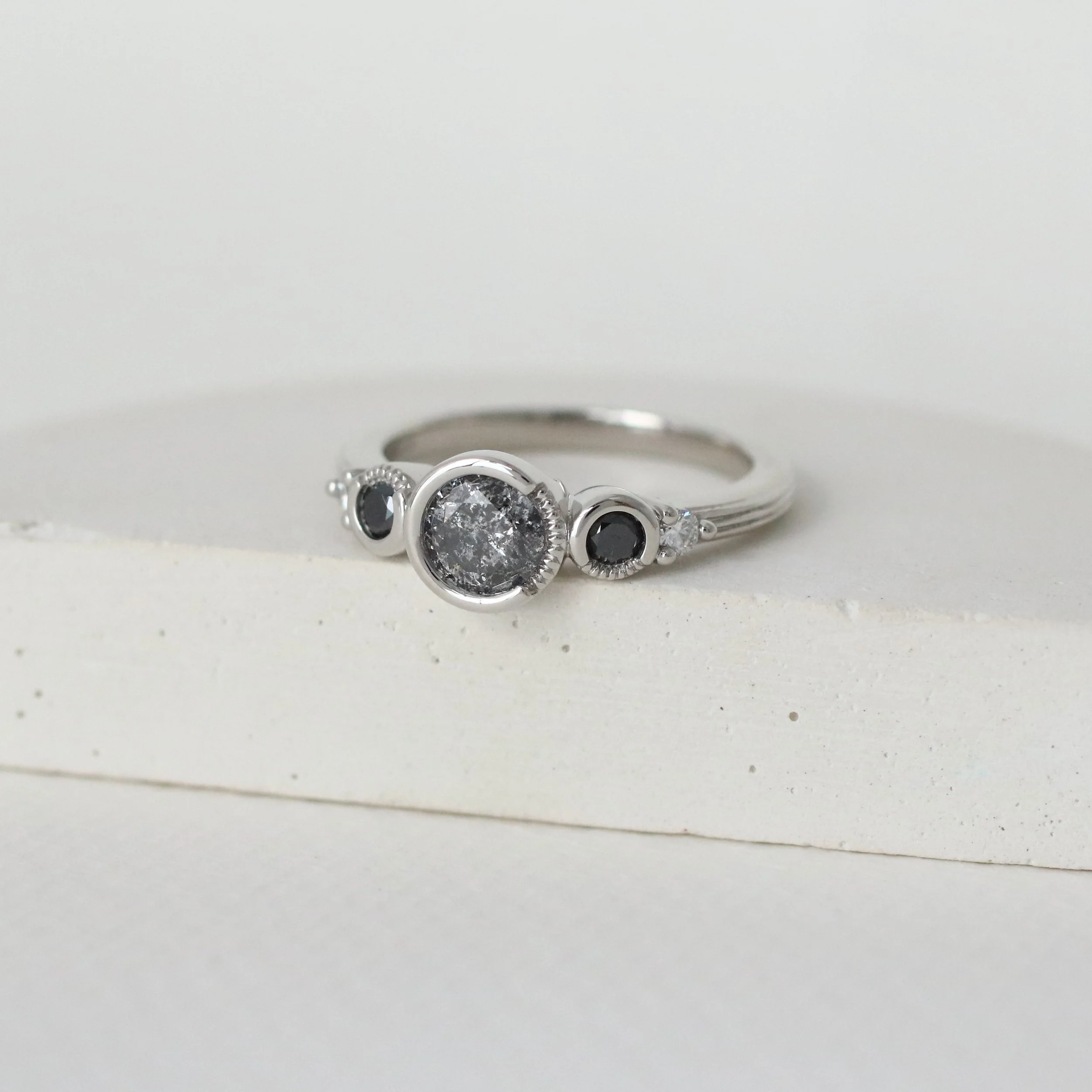 Congratulations are in order for Sara &amp; Brenden! They&rsquo;re another couple that was recently engaged and I couldn&rsquo;t be more excited to share their custom black + white engagement ring. And don&rsquo;t be fooled, there&rsquo;s a ton of sp