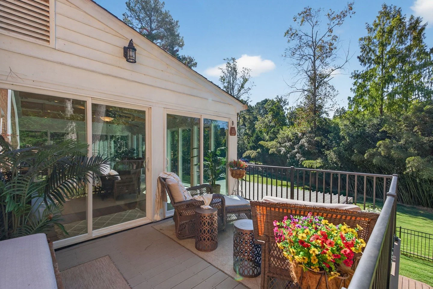 🌿 Backyard Patio Dream🌿 – 23 Whittaker’s Mill
 $1,169,000 | Bed: 6 | Bath: 5 Full, 1 Half |  Living Space: 5,813 SqFt 
 A vaulted sunroom with shiplap ceiling and cedar beams opens seamlessly to a Trex deck, overlooking a fenced yard a