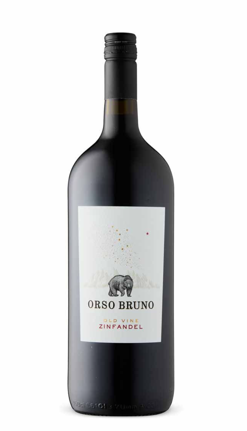 A bottle of Orso Bruno Old Vine Zinfandel wine with a black cap and a white label featuring a bear illustration and stars.