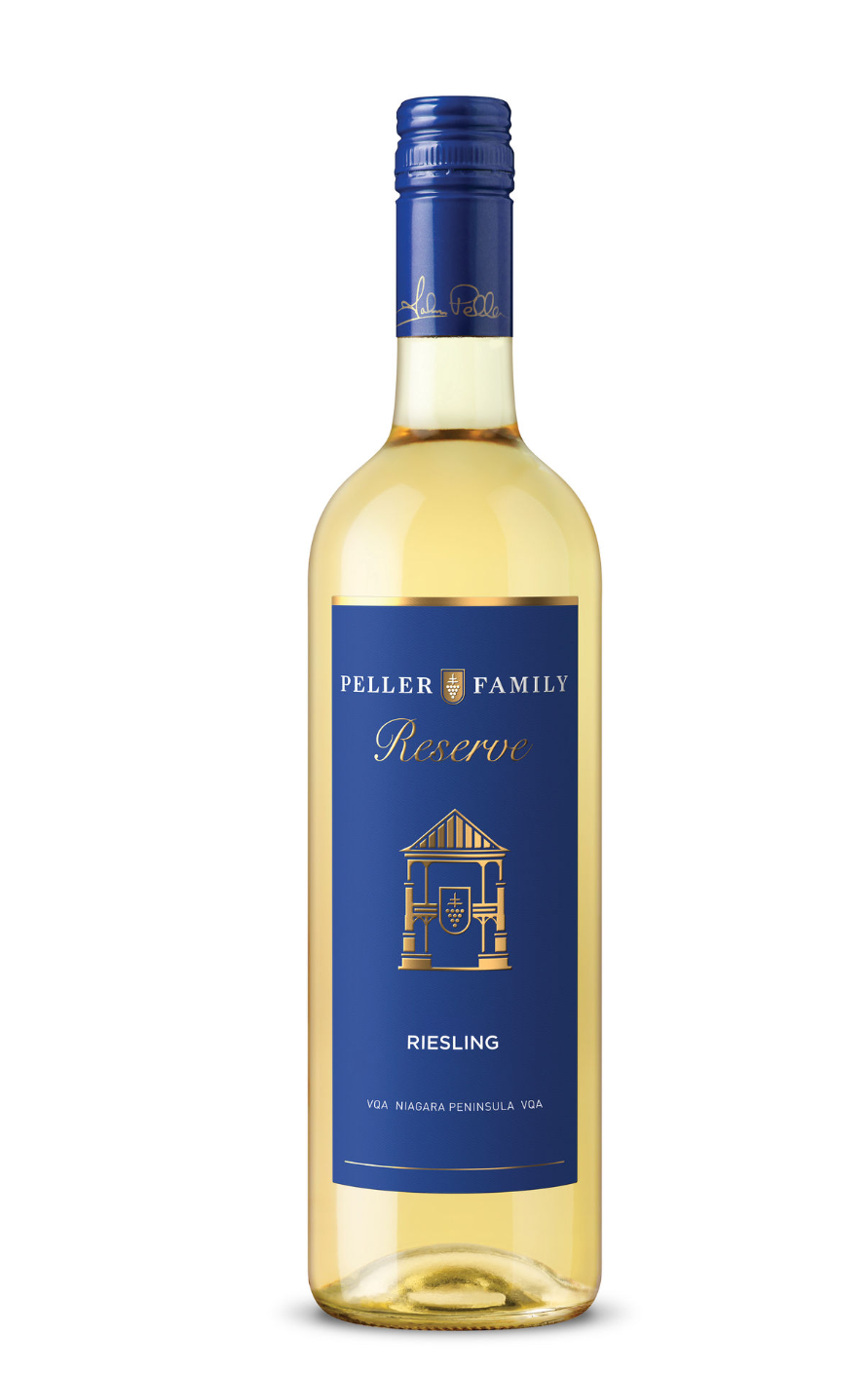 A bottle of Peller Family Reserve Riesling wine with a blue label, gold accents, and a blue screw cap. The label features a building illustration and text indicating it is a Riesling from the Niagara Peninsula.