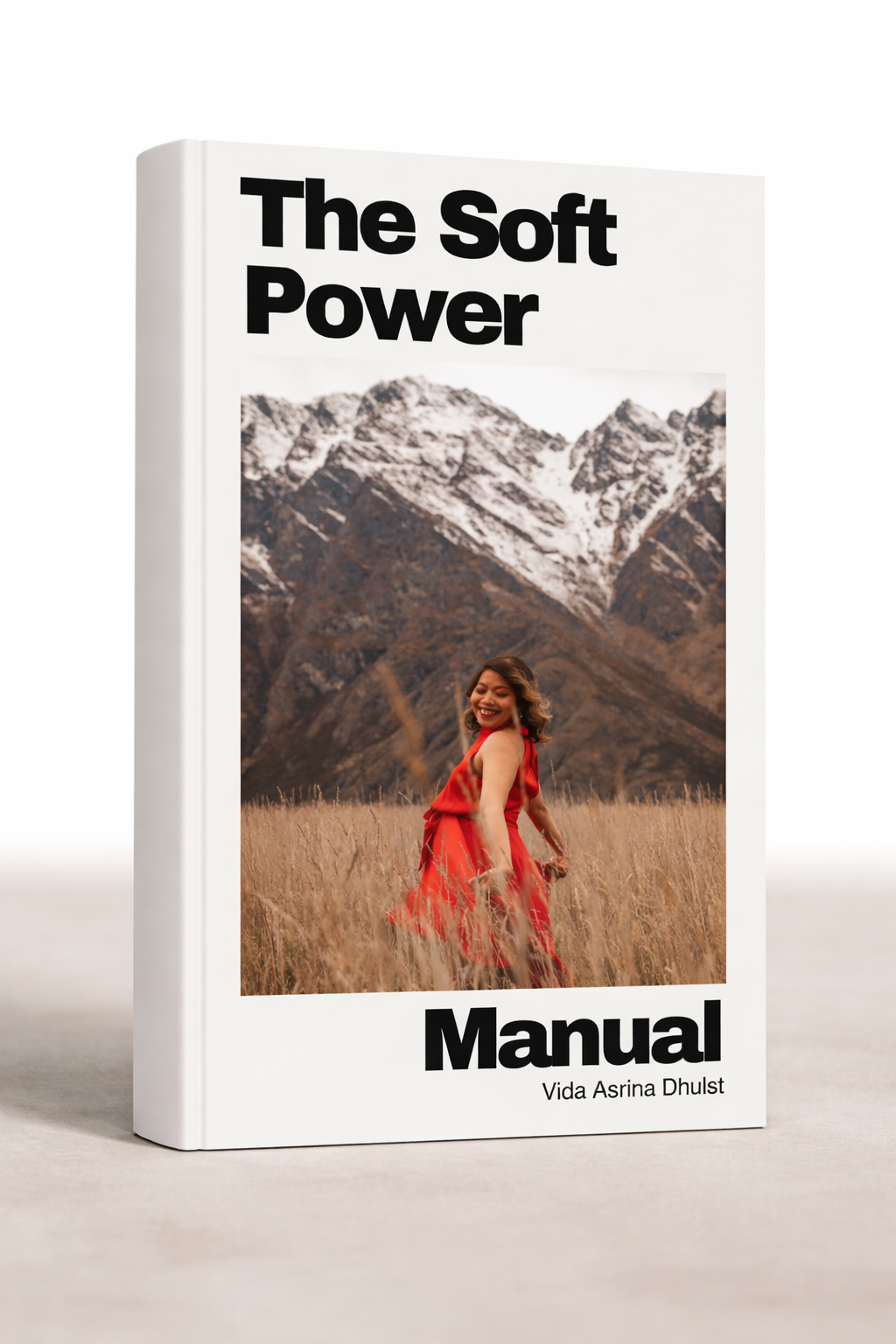 The Soft Power Manual book cover by Vida Asrina Dhulst, featuring a woman in a red dress standing in a field with mountains in the background.