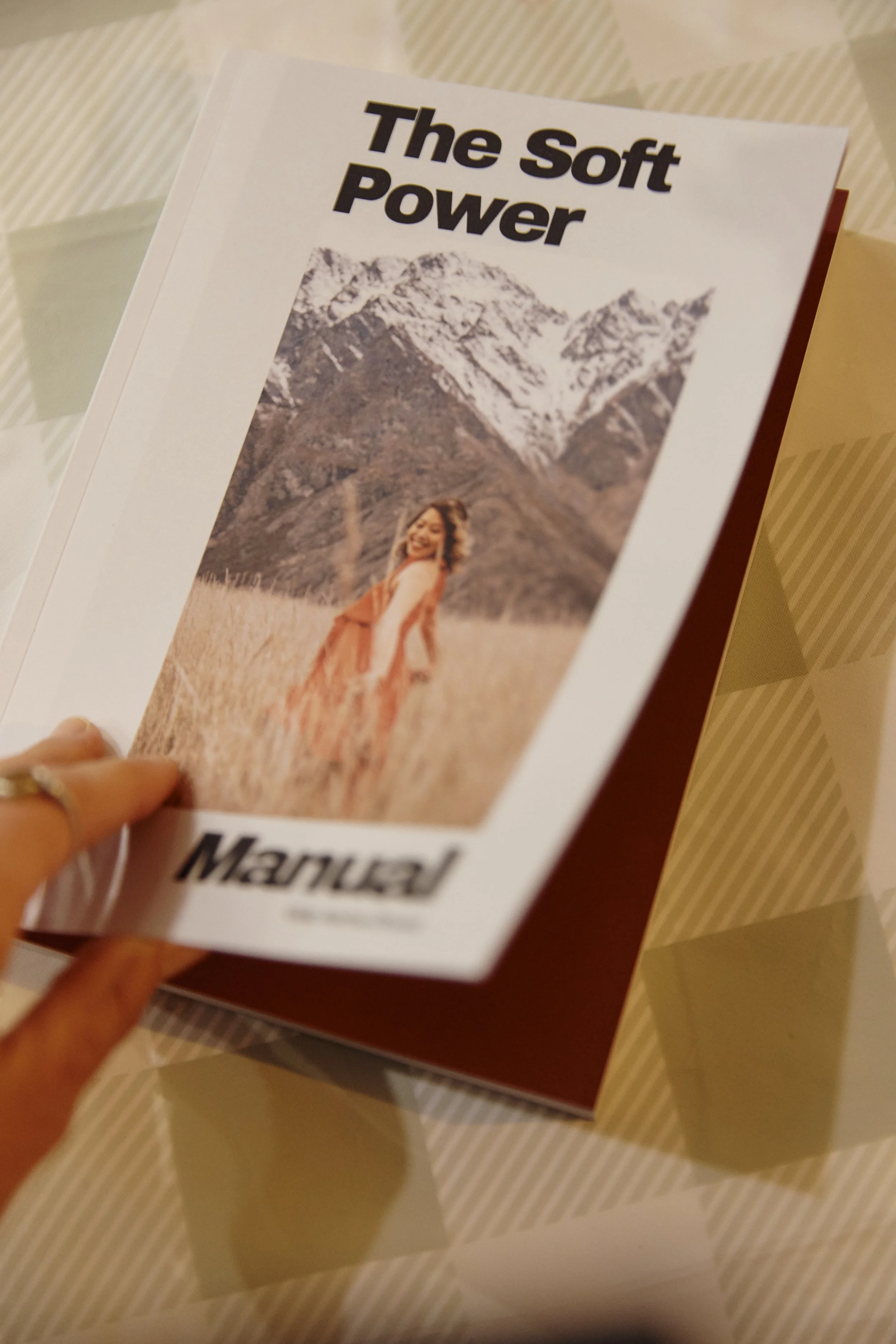 Physical copy of The Soft Power Manual by Vida Asrina Dhulst resting on a table during the Sydney book launch event