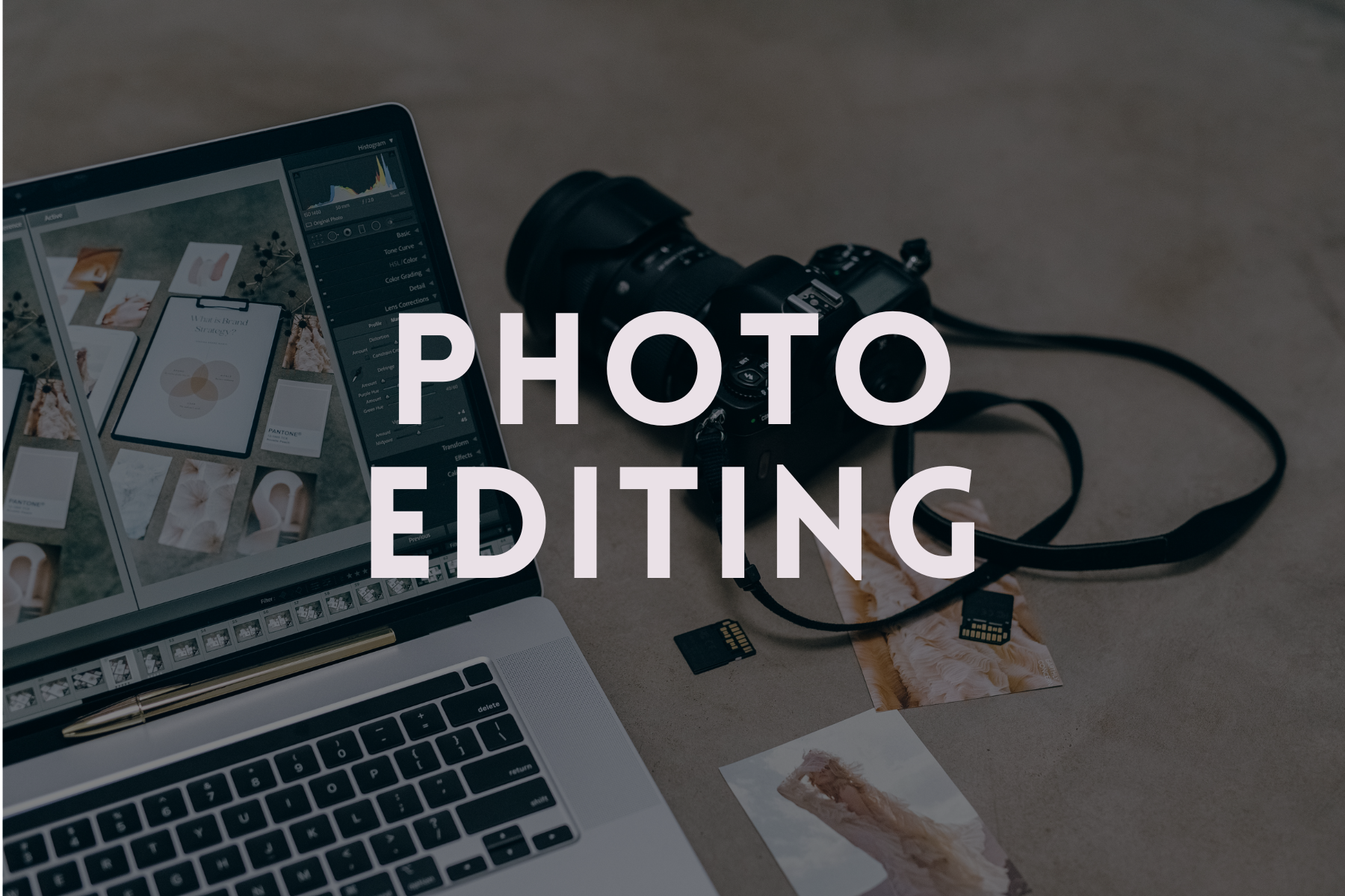 A laptop displaying photo editing software, a camera, SD cards, and printed photos on a neutral surface.