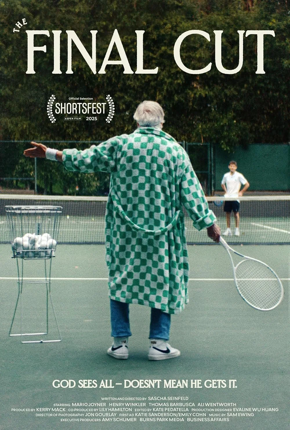 A scene from the movie 'The Final Cut' showing an older man with white hair wearing a green and white checkered coat, standing on a tennis court with a tennis racket in his hand, and a young woman in the background.