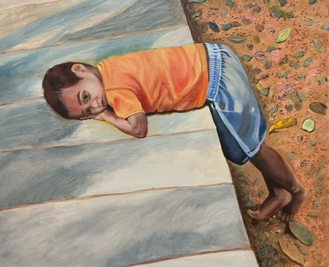 A painting of a young boy lying on a platform with his head resting on his hand, wearing an orange shirt and blue shorts.