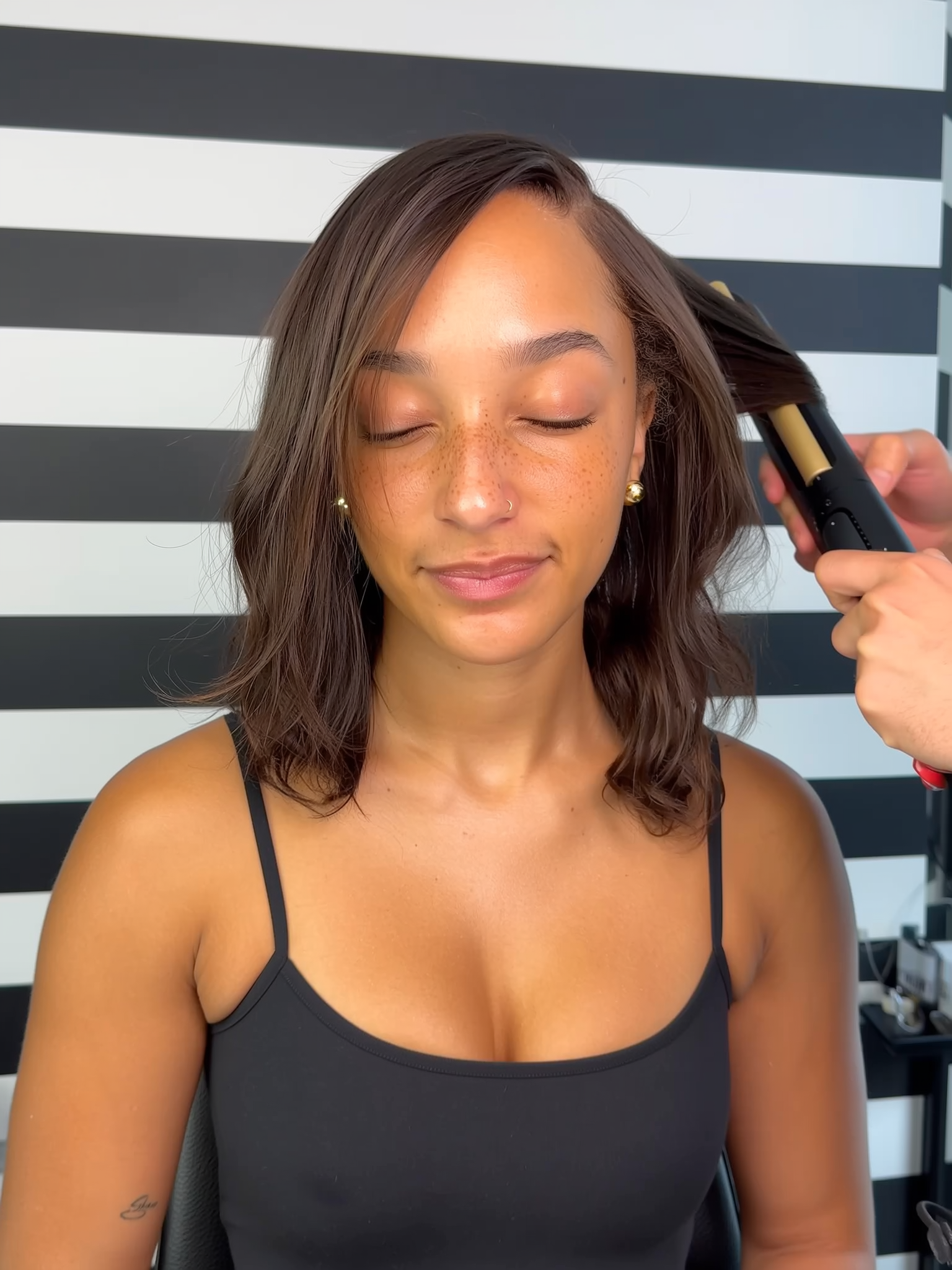 A black woman with a silk press.