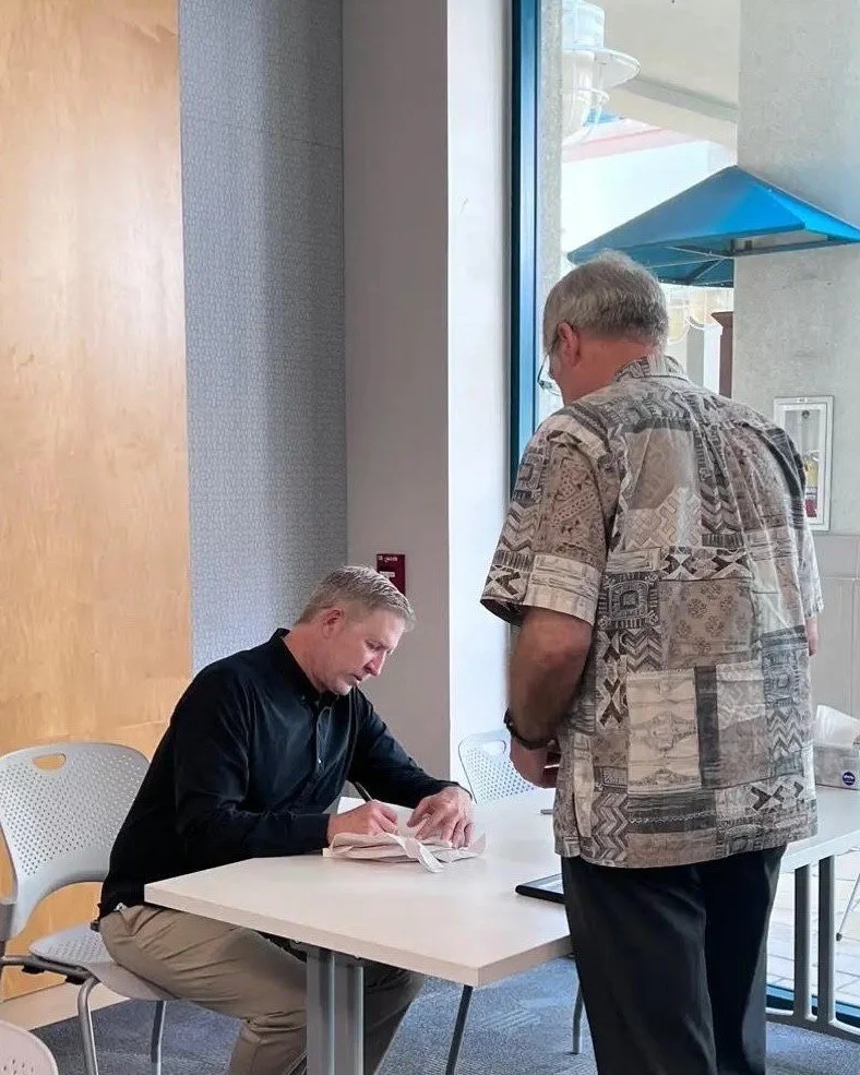 Book+Signing+after+a+presentation+Pic+2.jpg