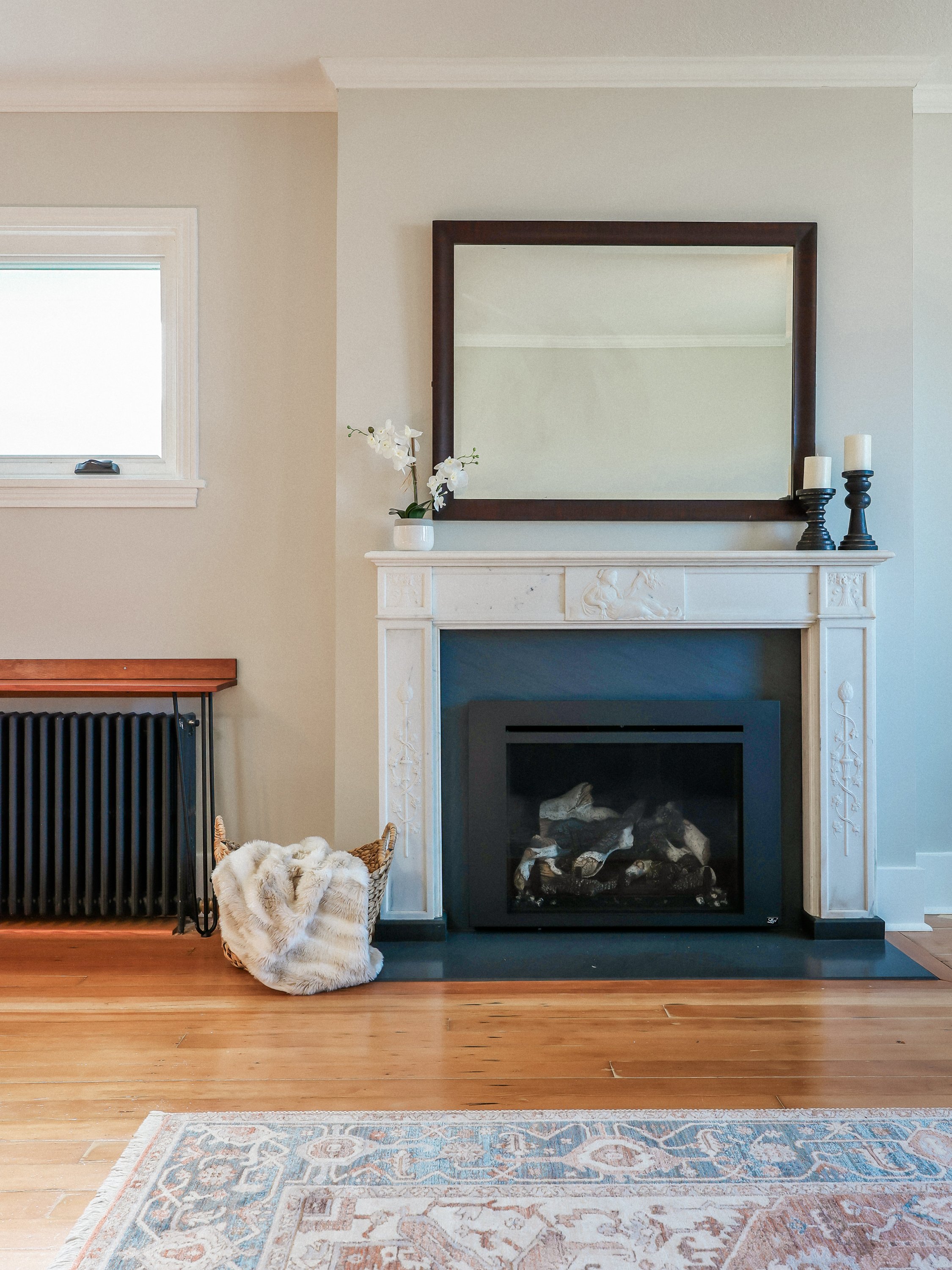 Fix:
- Built in bump out
-historic soapstone hearth and surround
-antique marble stone mantle
-new gas insert
-refinished douglas fir floor
-deep wood baseboards