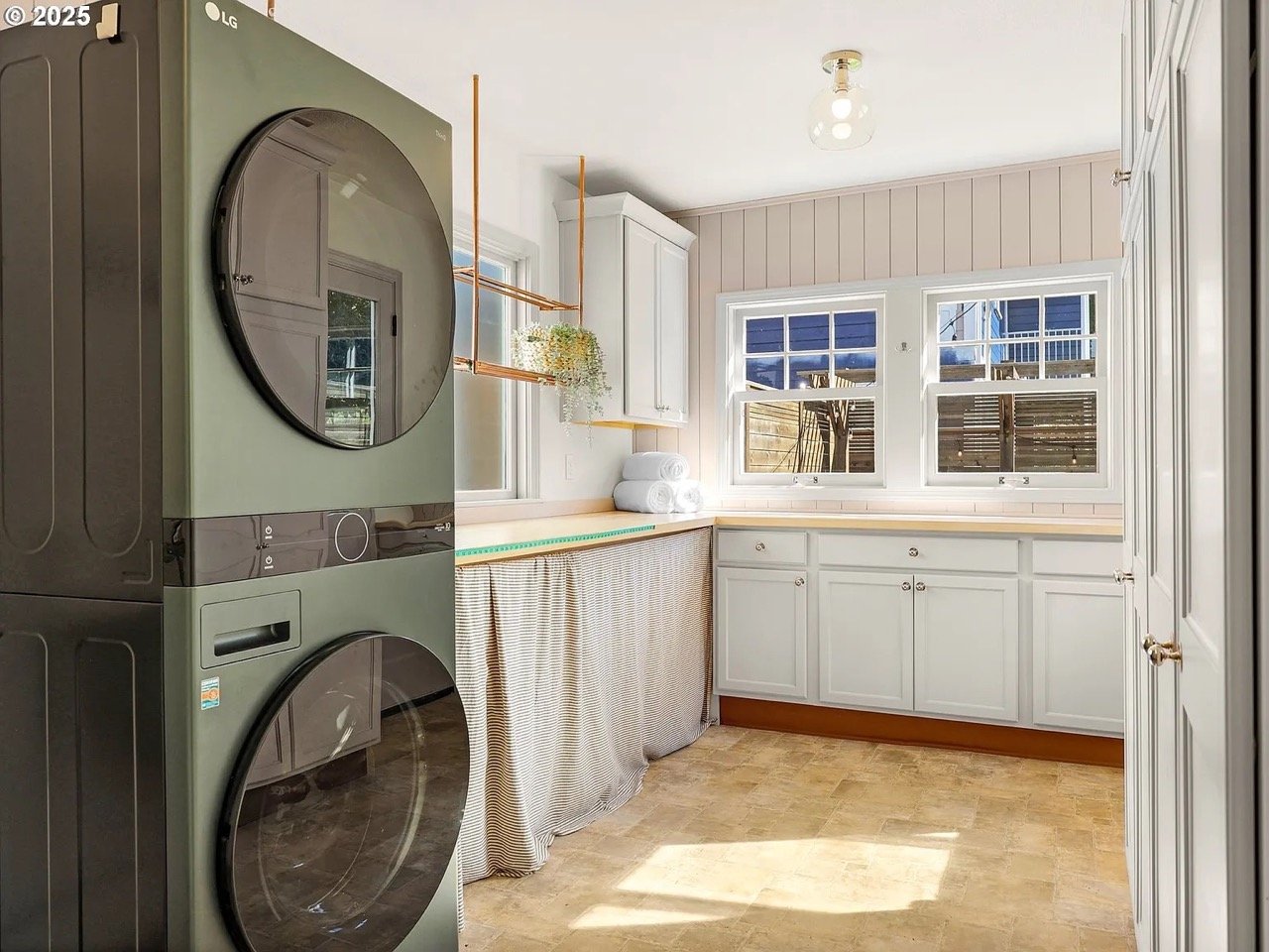 The fix: A wash tower allows for a farmhouse laundry sink. Extra storage provides space to store winter garb.