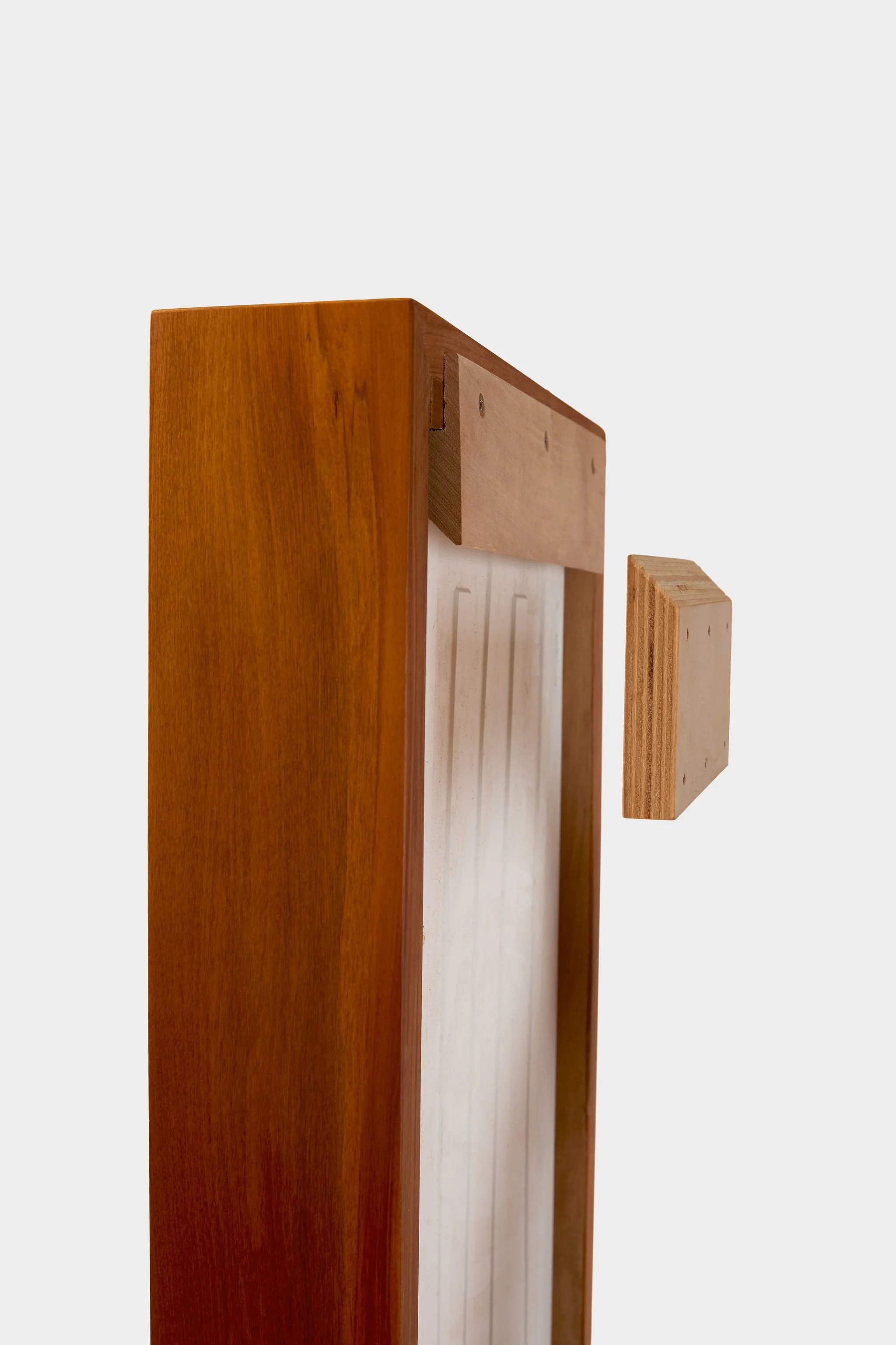 Wall-mounted: A hidden wooden hanging bracket allows the lamp to be easily and securely fixed to the wall, sitting flush and stable.