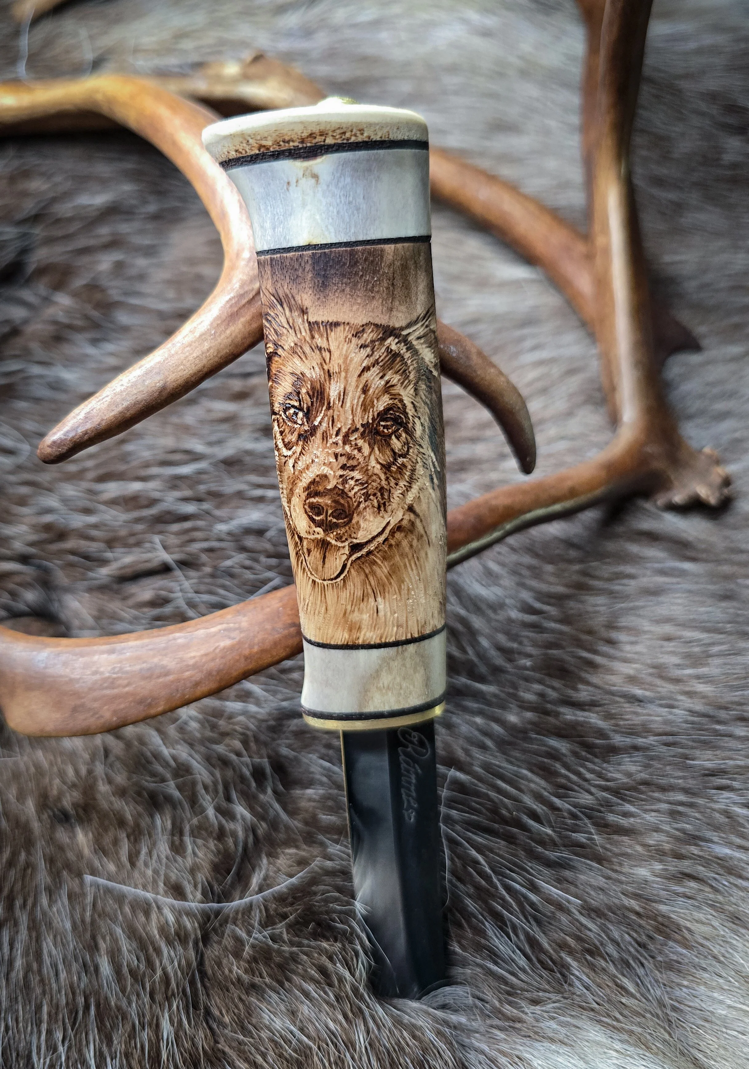 Handmade knife with handmade portait of dog. Made in Lapland.