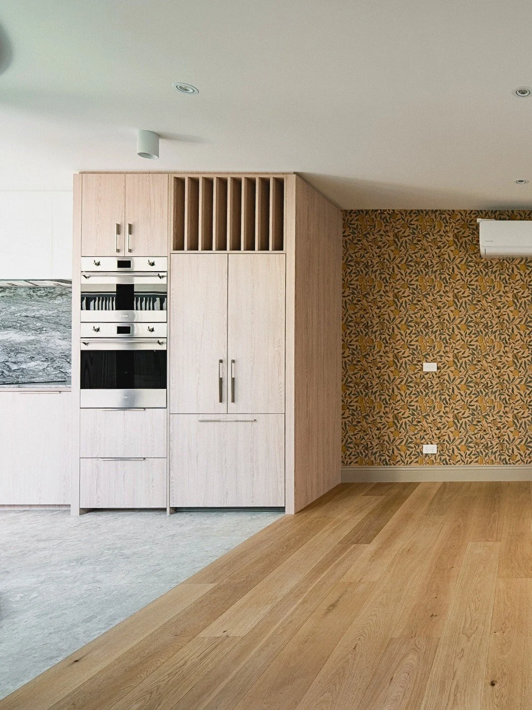 Station Street Project &ndash; Kitchen &amp; Living

This isn't just a beautiful kitchen, it's built for how our clients really use their home.

Custom light oak cabinetry with vertical plate rack detailing and integrated appliances. The kitchen feat