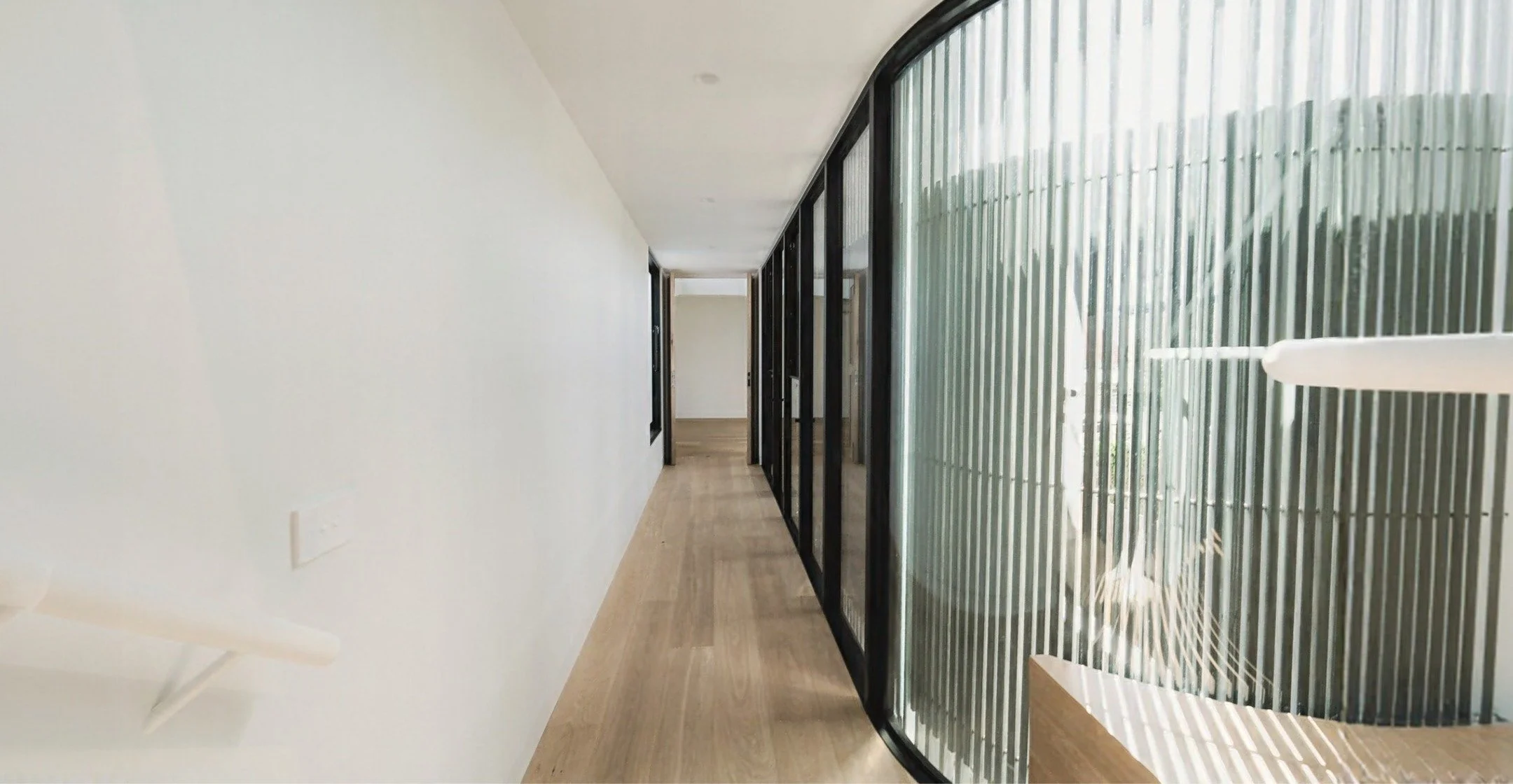 There's something special about a curved glass wall that follows the architecture rather than fights it.

Good design isn't about adding complexity &ndash; it's about solving problems elegantly. This curved detail does exactly that.

By following the