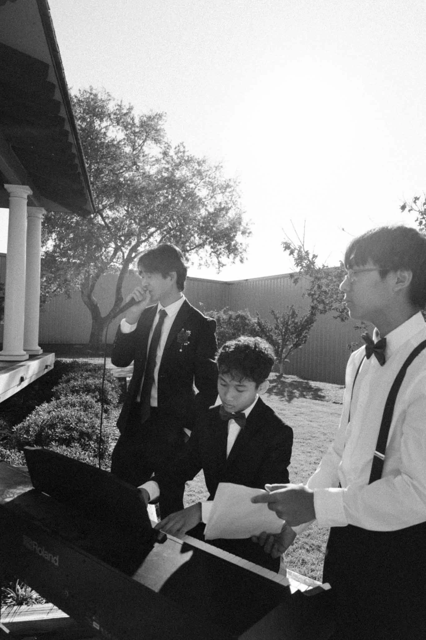 Famous Karenni singer Darnai singing at his sister’s wedding while a younger brother plays the piano