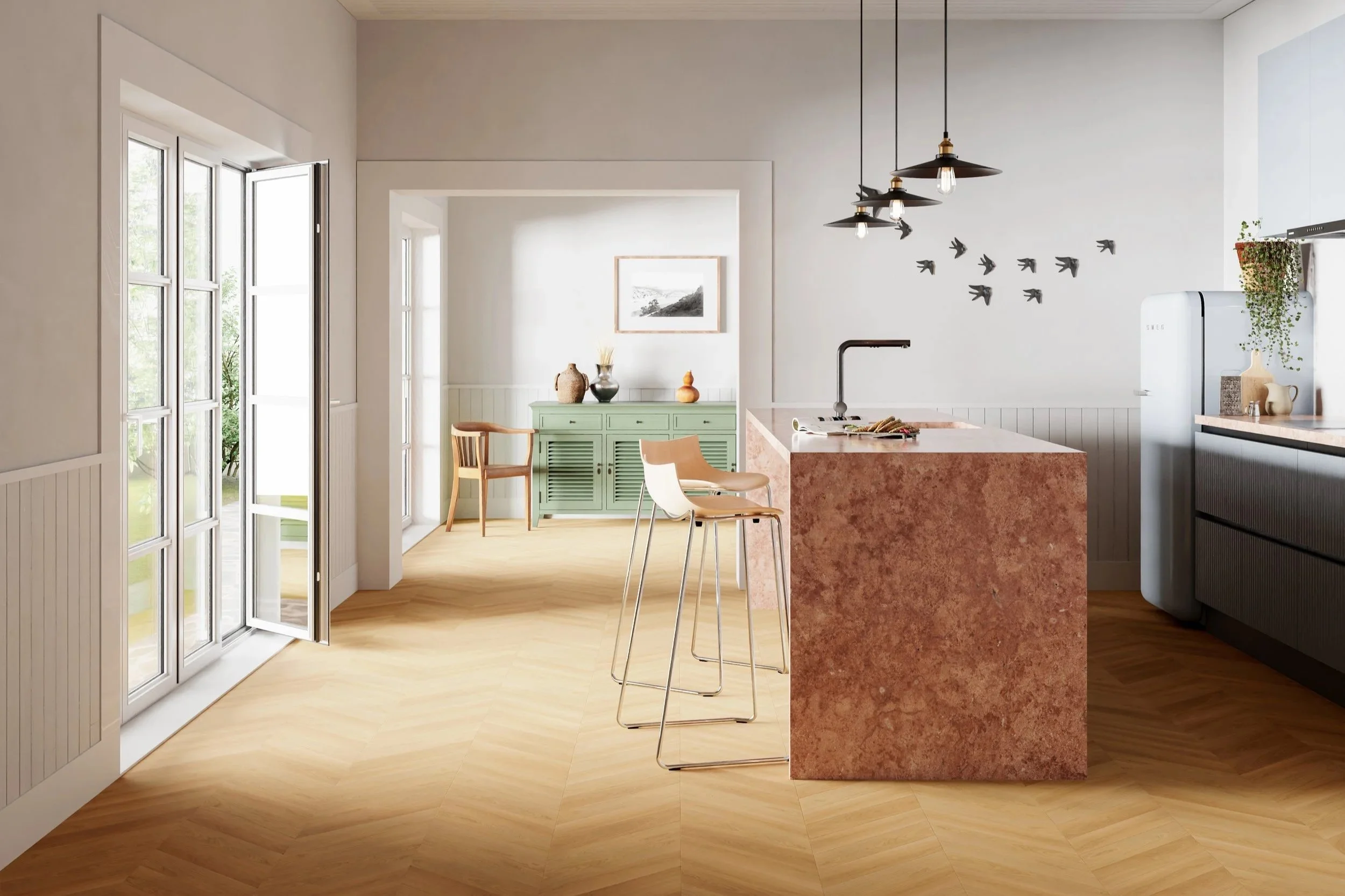 Cozinha moderna com bancada de mármore rosa, geladeira branca, iluminação pendente preta, parede decorada com pássaros pretos, móveis brancos e um aparador verde claro com objetos decorativos.