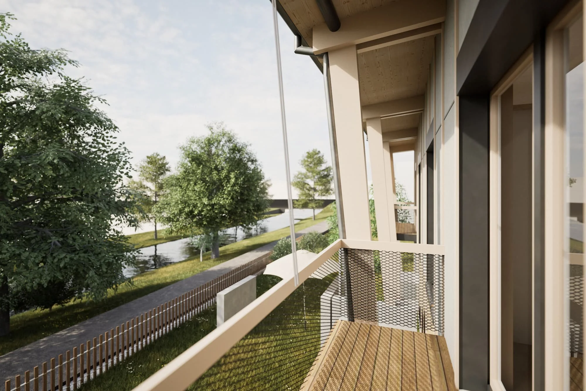 Balkon mit Blick auf einen Fluss und grüne Bäume