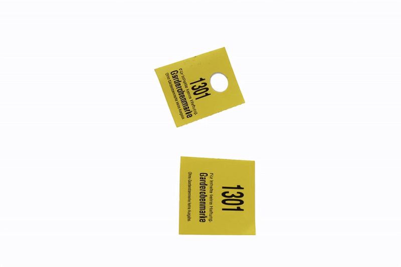 Two yellow vehicle waiting tickets, one marked 1301 and the other 1301, with black text on a white background.
