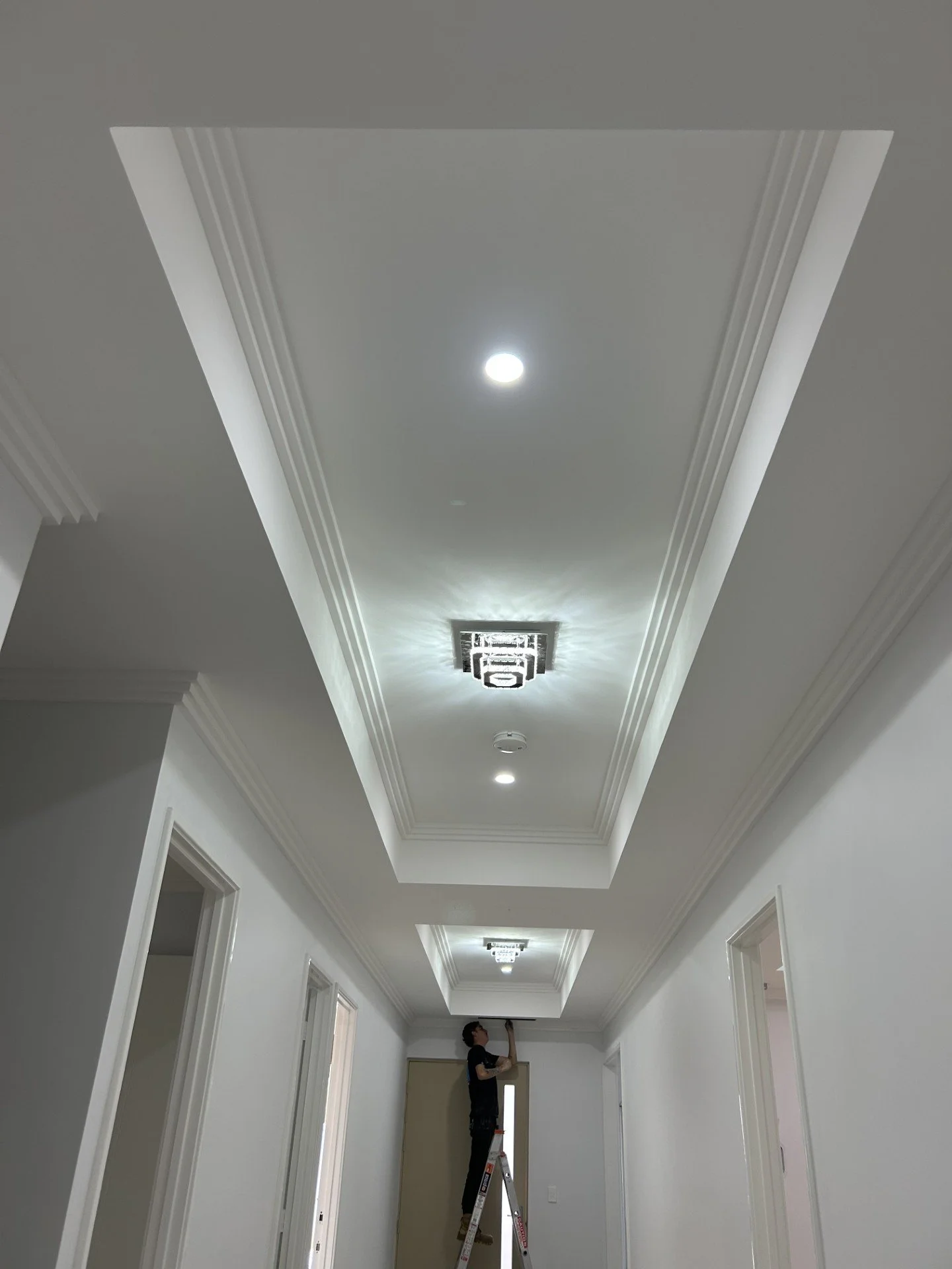 Image of a beautiful pendant light hanging in a hallway installed by a Perth 