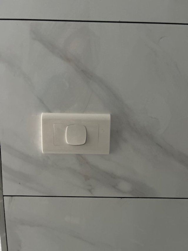 Image of a NDIS compliant electrical switch installation, completed by Price Family electricians.