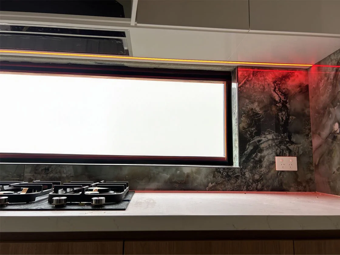 Image of strip LED lighting under a over head cabinet in a kitchen, installed by Price Family Electricians in Perth