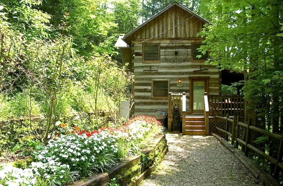 A genuine 1800s log cabin with a  fireplace and private hot tub.  Timberidge Cabins - Gatlinburg, TN