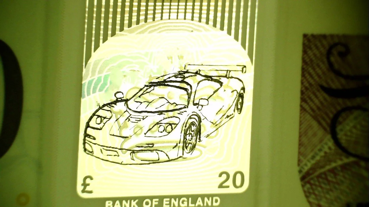 Graham Short's Micro Engraving of a McLaren Car on a 20 Poound Note.jpg