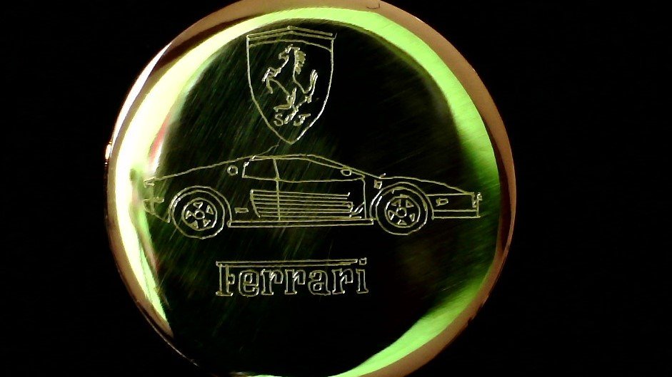Graham Short's Micro Engraving of a Ferrari Within the Eye of a Needle.jpg