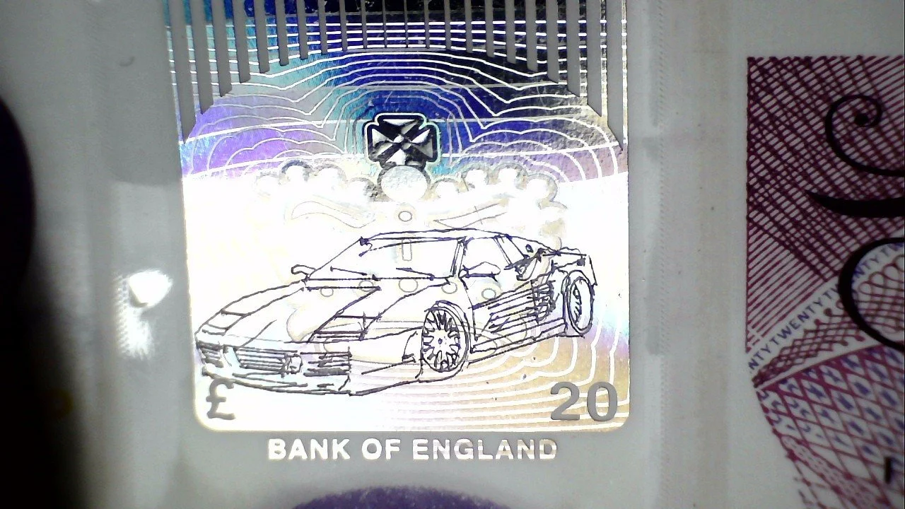 Graham Short's Micro Engraving of a Ferrari on a 20 Pound Note.jpg