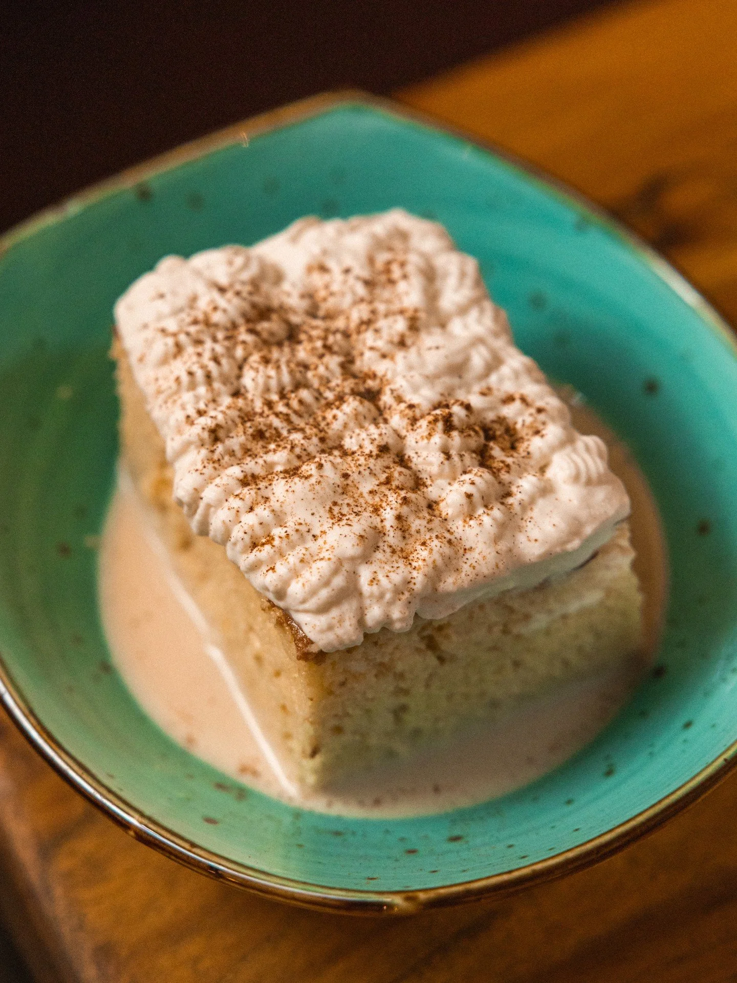 Irish Coffee Tres Leches - yep, you read that right.

First, we soak sponge cake in a combination of three milks: evaporated, condensed, and whole, with a touch of Baileys and our San Patricios coffee blend, featuring Andytown coffee and Caf&eacute; 
