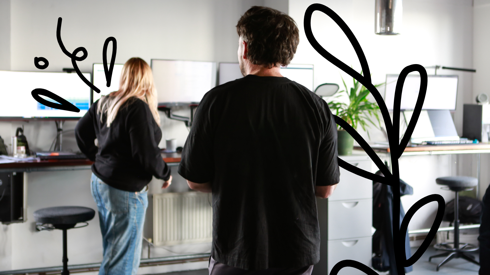 Two people stood in an office.