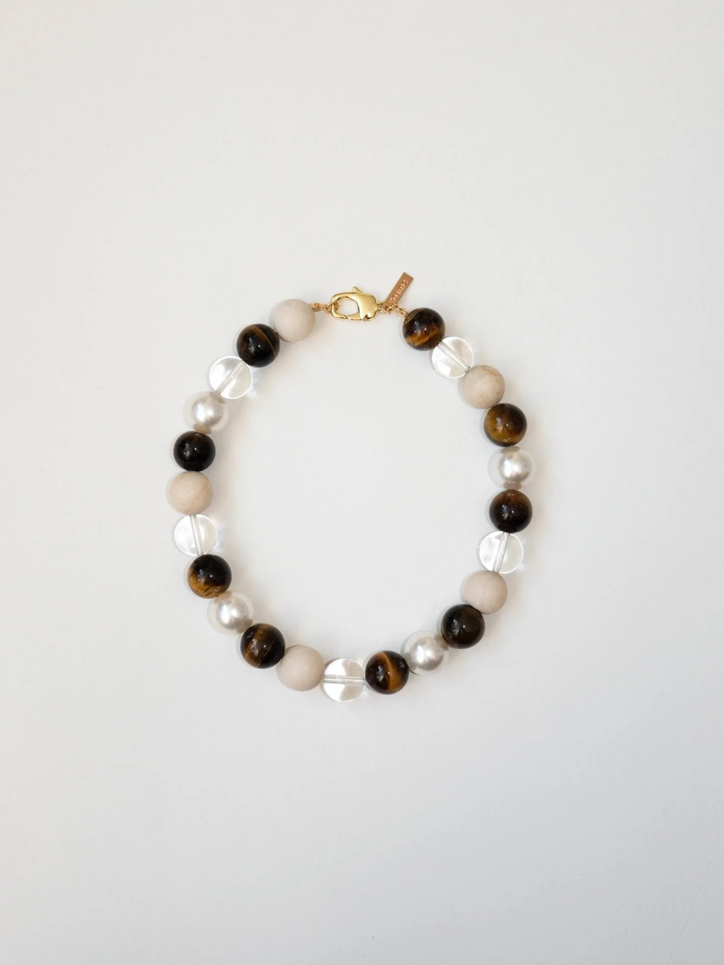 Our signature &ldquo;Roam&rdquo; set is now online! A playful classic for every occasion. Made out of tiger eye, shell pearl, glass and fossil beads. Customise your size &amp; metal color.