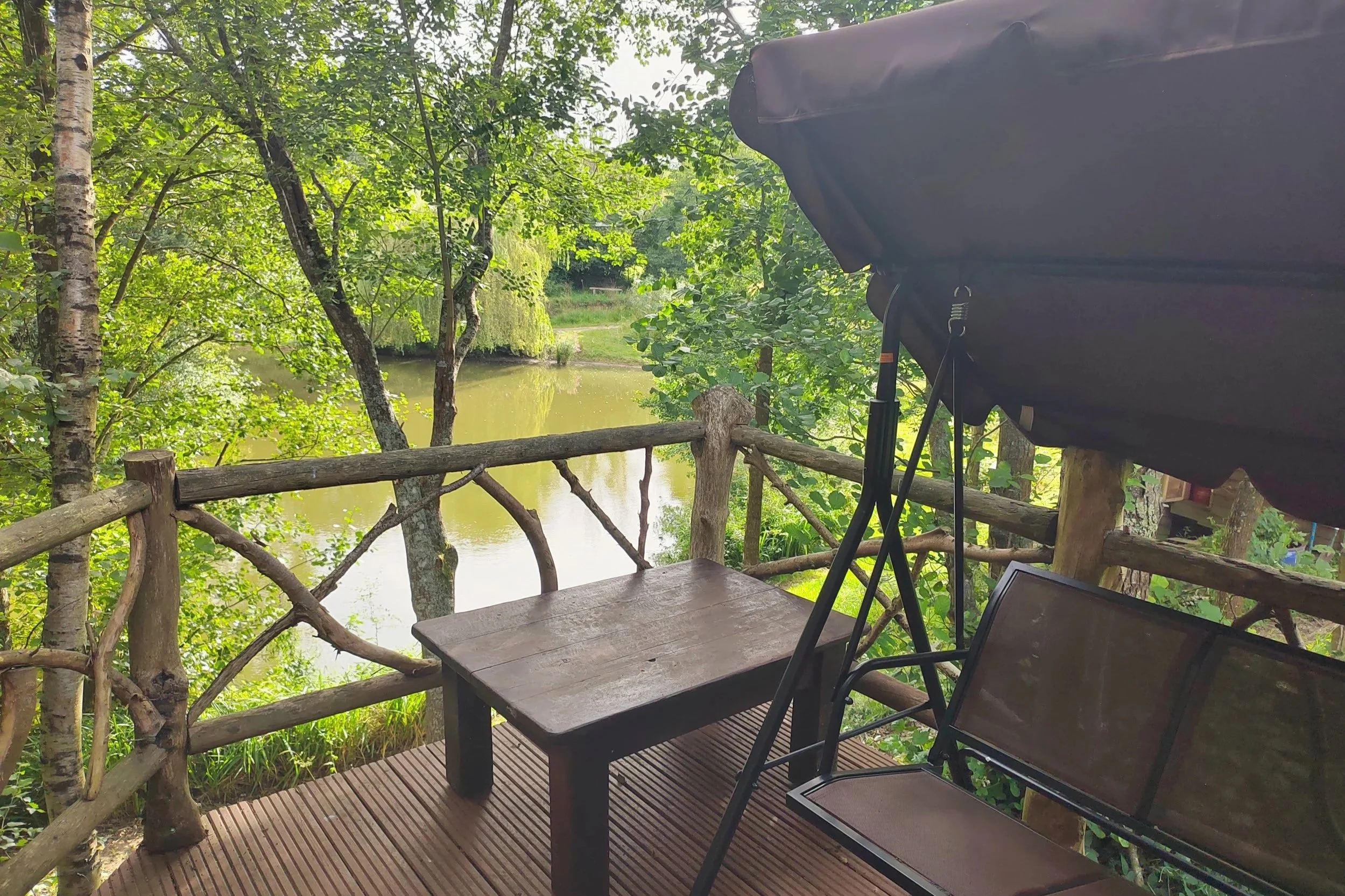 The Shepherd’s Hut at Goldcrest   - A self-contained lakeside cabin, ideal for a couple, with its own simple kitchen and a private decking area with swing seat for serene morning experiences. 
