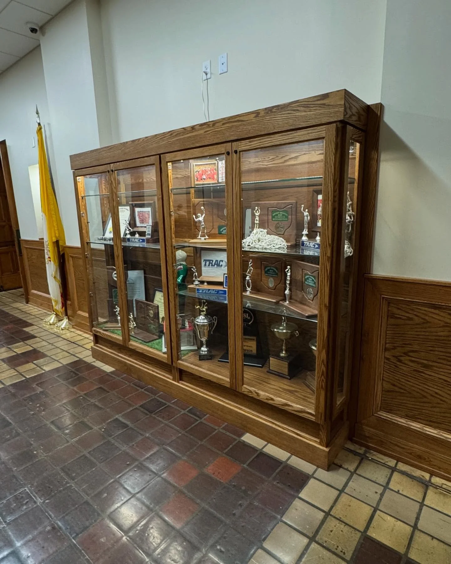 Stopped by the first floor after installing the Gene Kranz/moon rock display case on the second floor at @toledocentralcatholic to check on the trophy cases now that they have some hardware inside 🏆. One case is dedicated to current sports trophies
