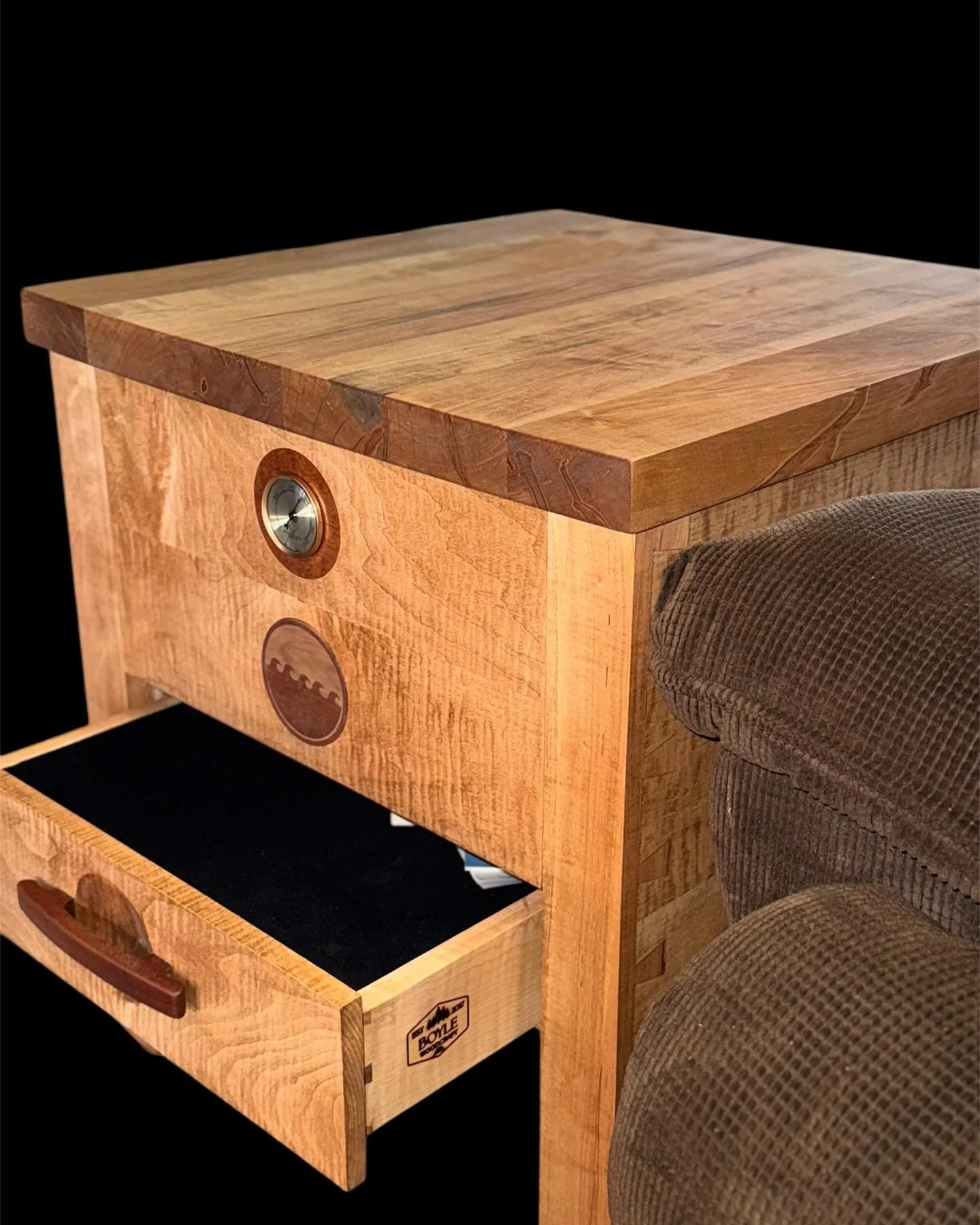 Another end table humidor…the top and legs are rustic maple on this one and the sides are curly maple. Approx dimensions: 24” wide, 24” deep, 26” tall.
The interior, of course, is completely lined with Spanish cedar and wit
