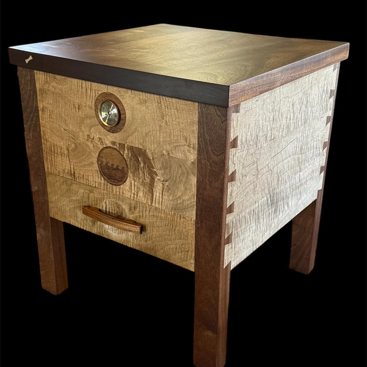 End table humidor…the top and legs are mahogany and the sides are curly maple. Approx dimensions: 24” wide, 24” deep, 26” tall.
The interior, of course, is completely lined with Spanish cedar and with its three levels of st