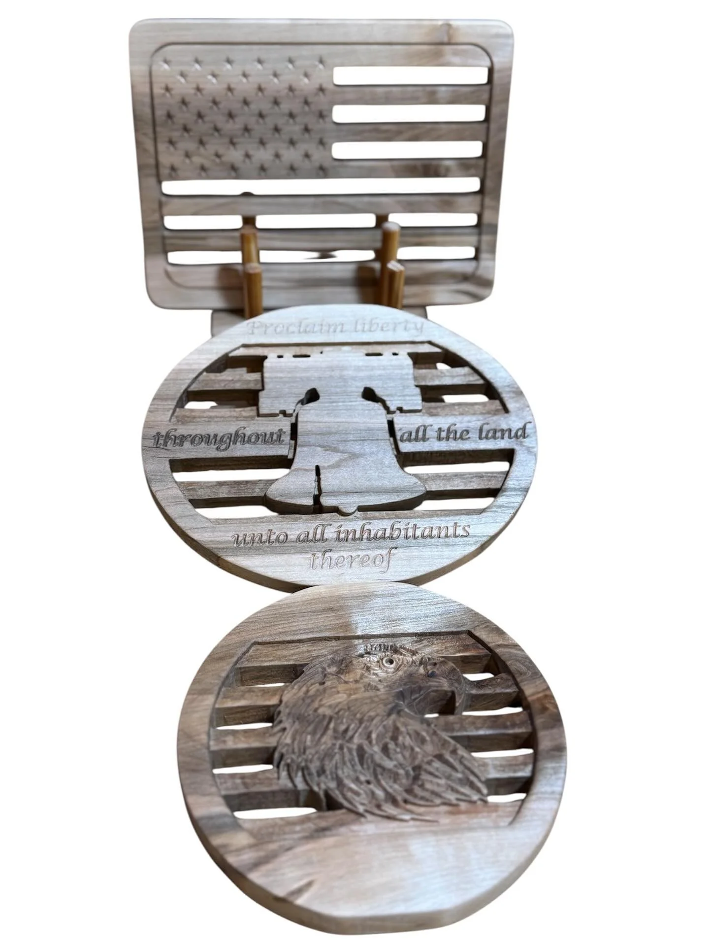 Protect your surfaces from those hot pots and pans with some rustic style! This patriotic trivet set features an American flag, the liberty bell, and a bald eagle…and also comes with a display/storage rack. You can pick up your set on the new